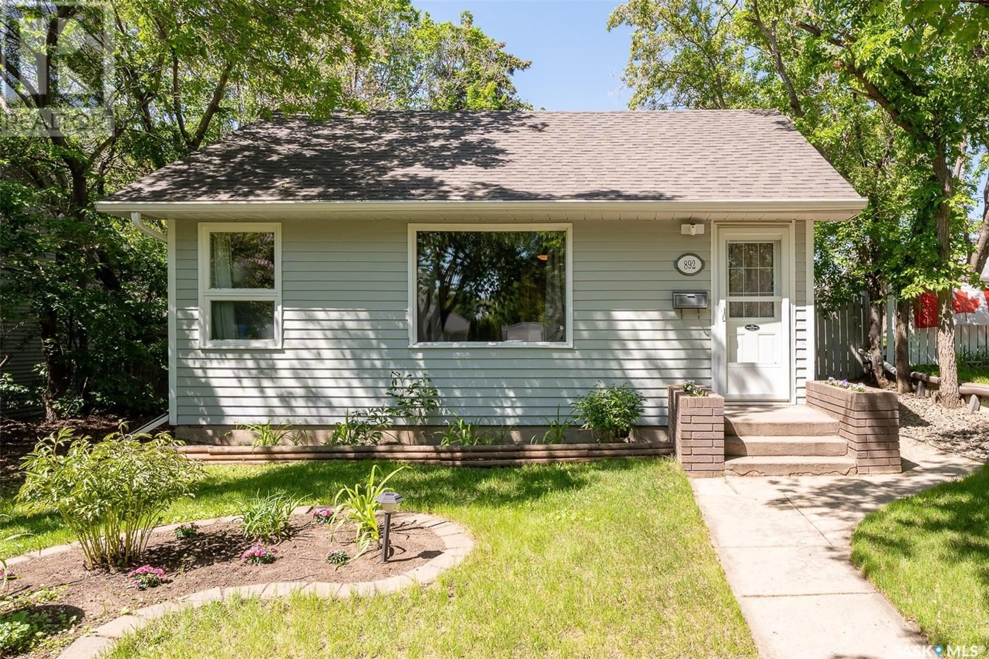 Home with vinyl exterior material, street for 892 ALGOMA AVENUE, Moose Jaw Saskatchewan S6H3Z3