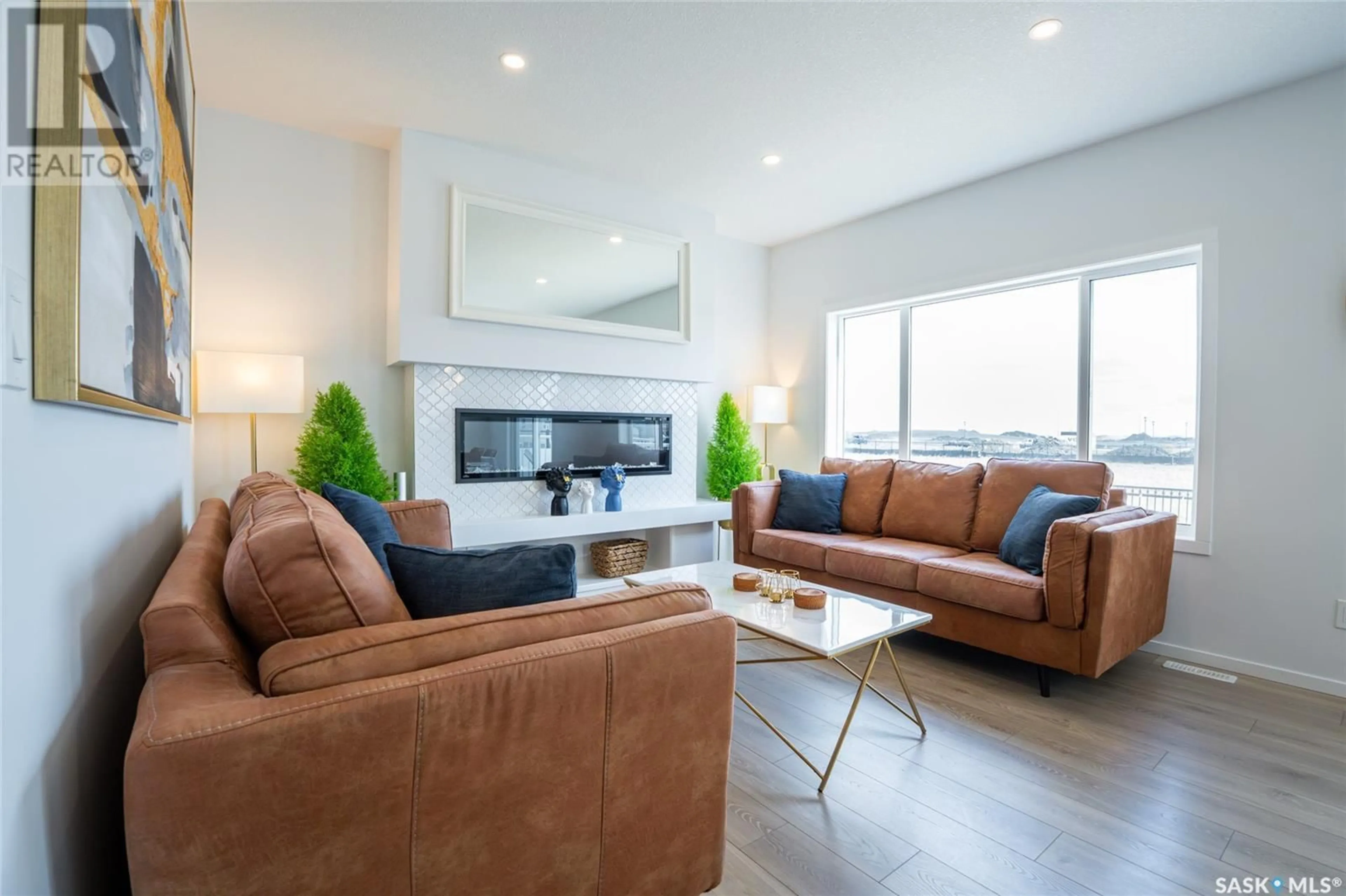 Living room with furniture, wood/laminate floor for 3033 BELLEGARDE CRESCENT, Regina Saskatchewan S4V3W3