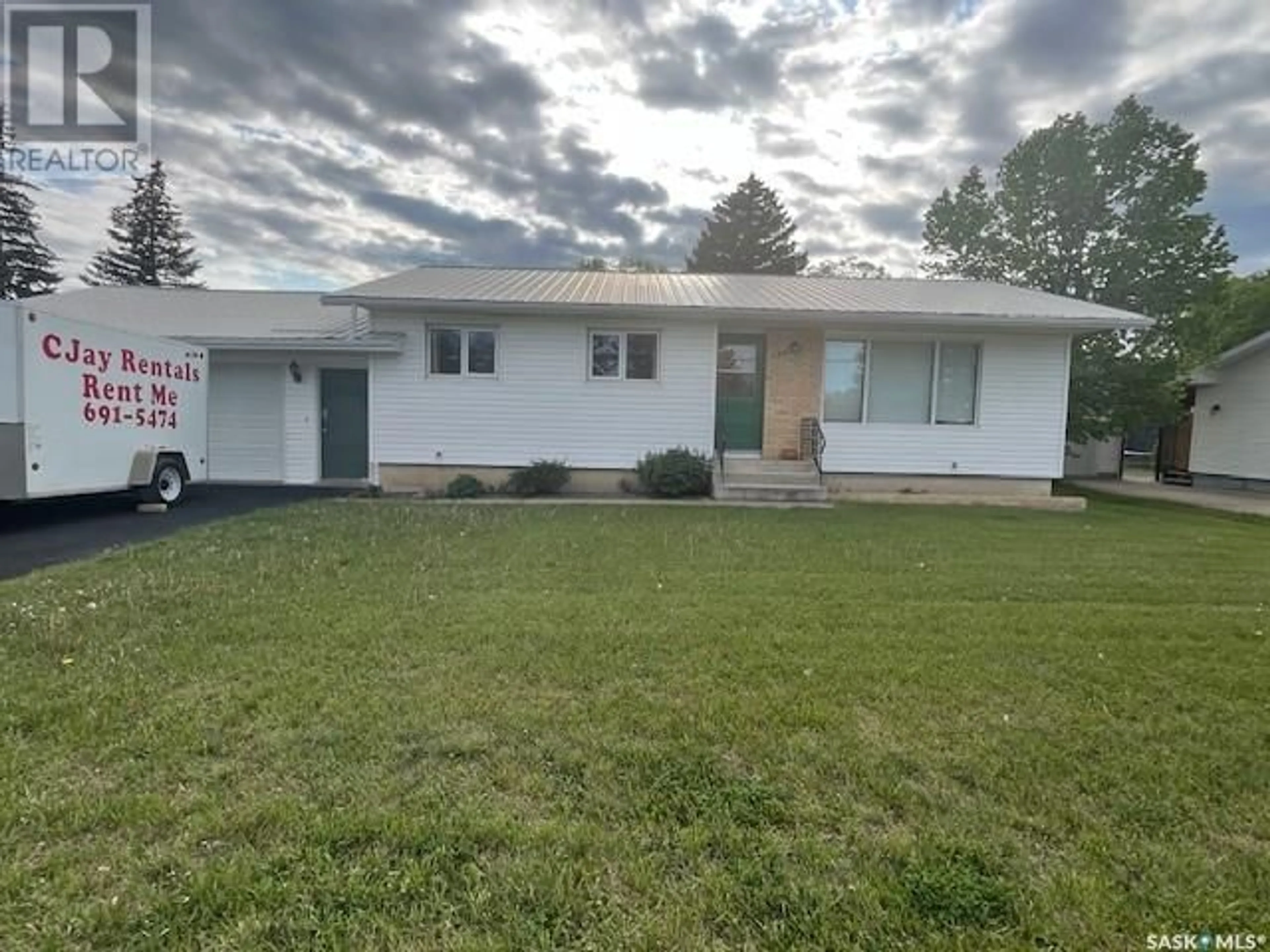 Home with vinyl exterior material, street for 400 CENTRE STREET, Caronport Saskatchewan S0H0S0