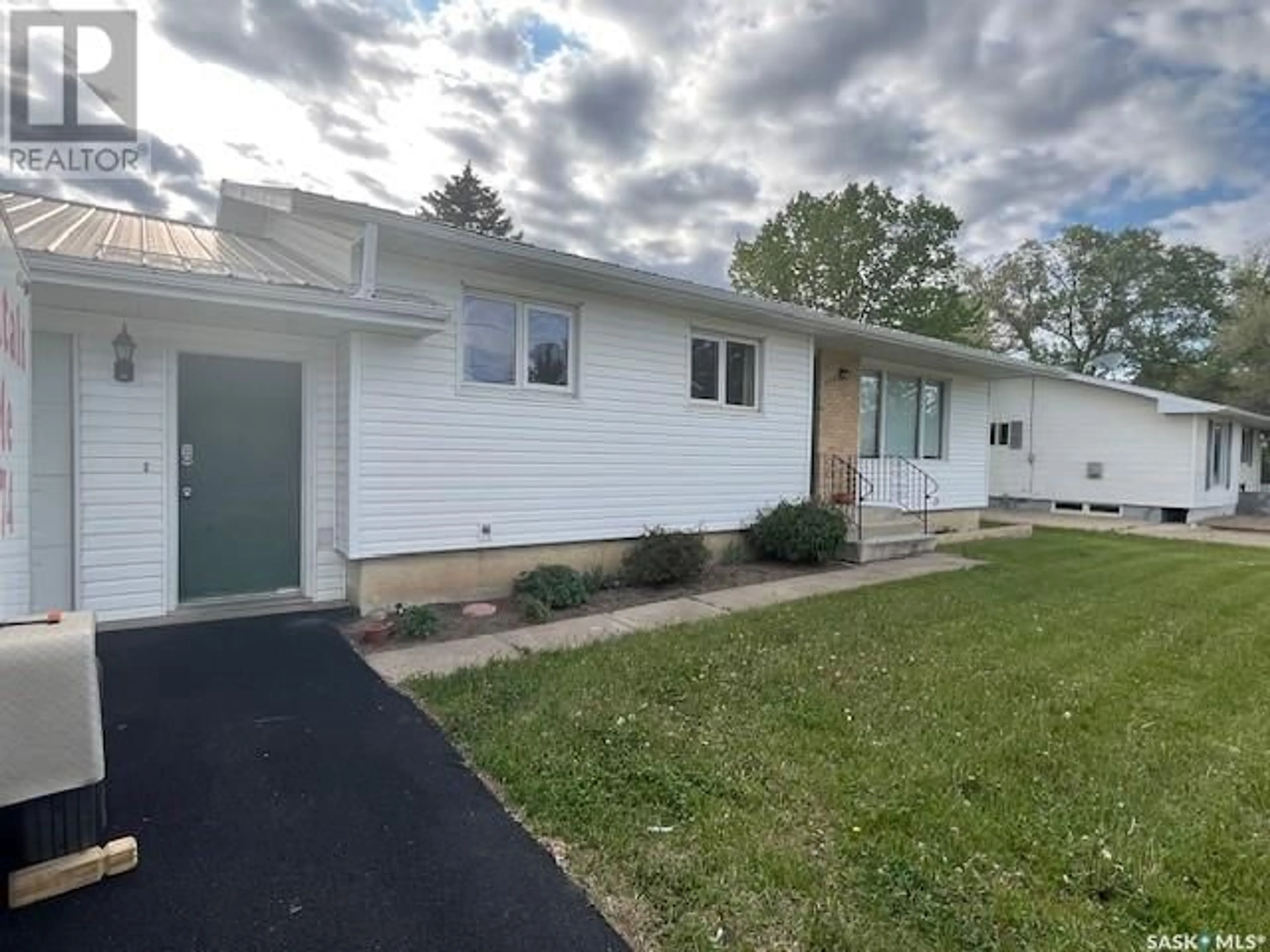 Home with vinyl exterior material, street for 400 CENTRE STREET, Caronport Saskatchewan S0H0S0