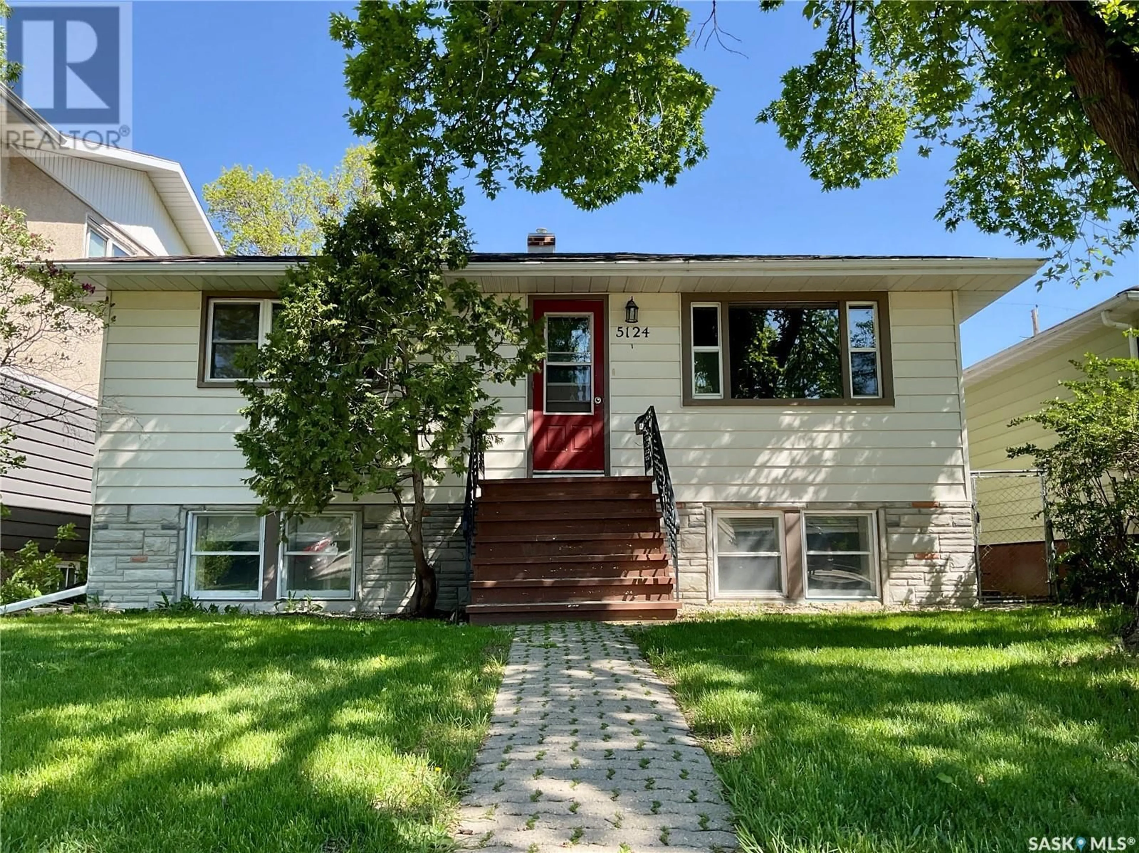 Home with vinyl exterior material, street for 5124 8TH AVENUE, Regina Saskatchewan S4T0W5