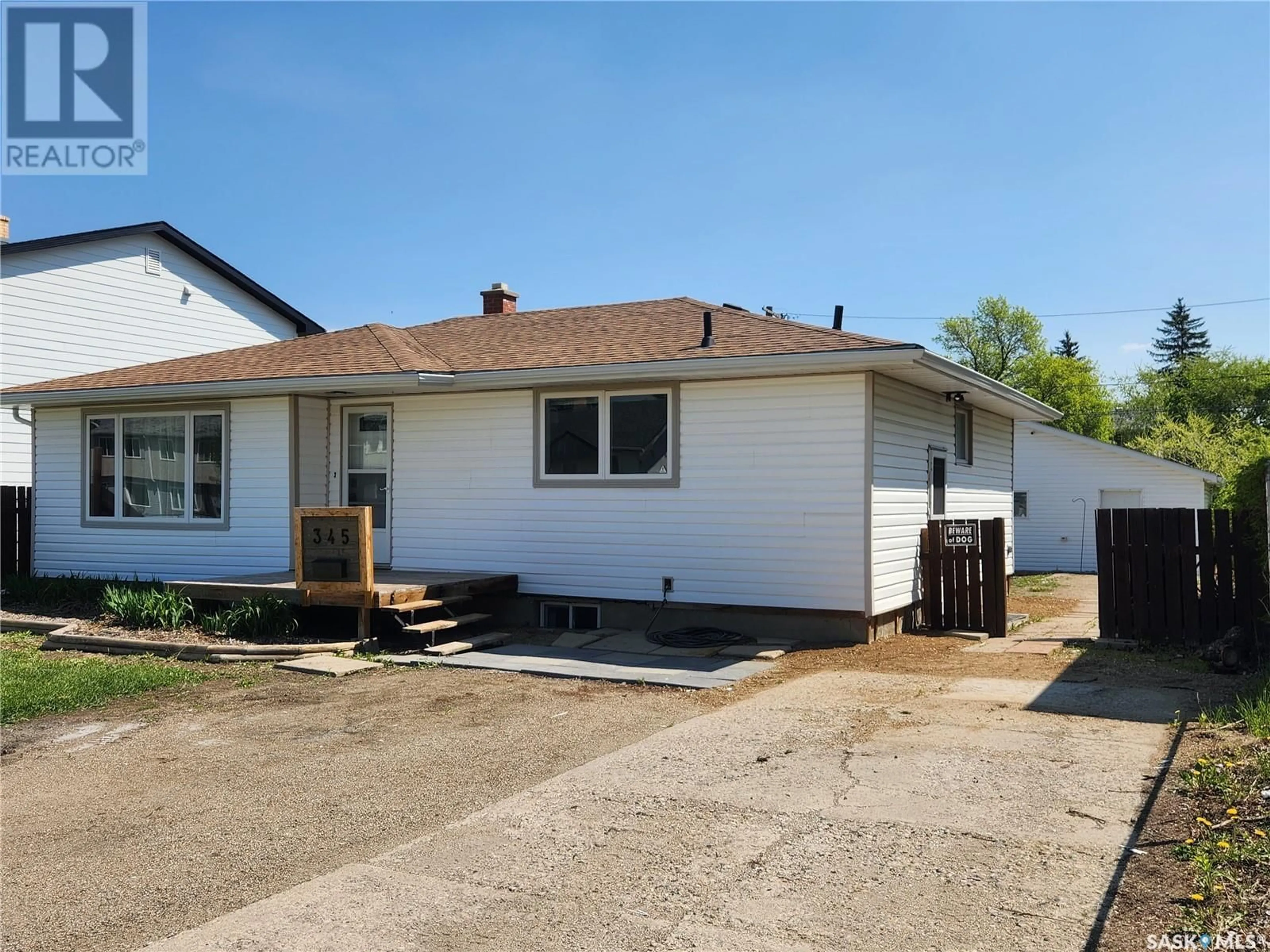 Home with vinyl exterior material, street for 345 FORGET STREET, Regina Saskatchewan S4R4X7