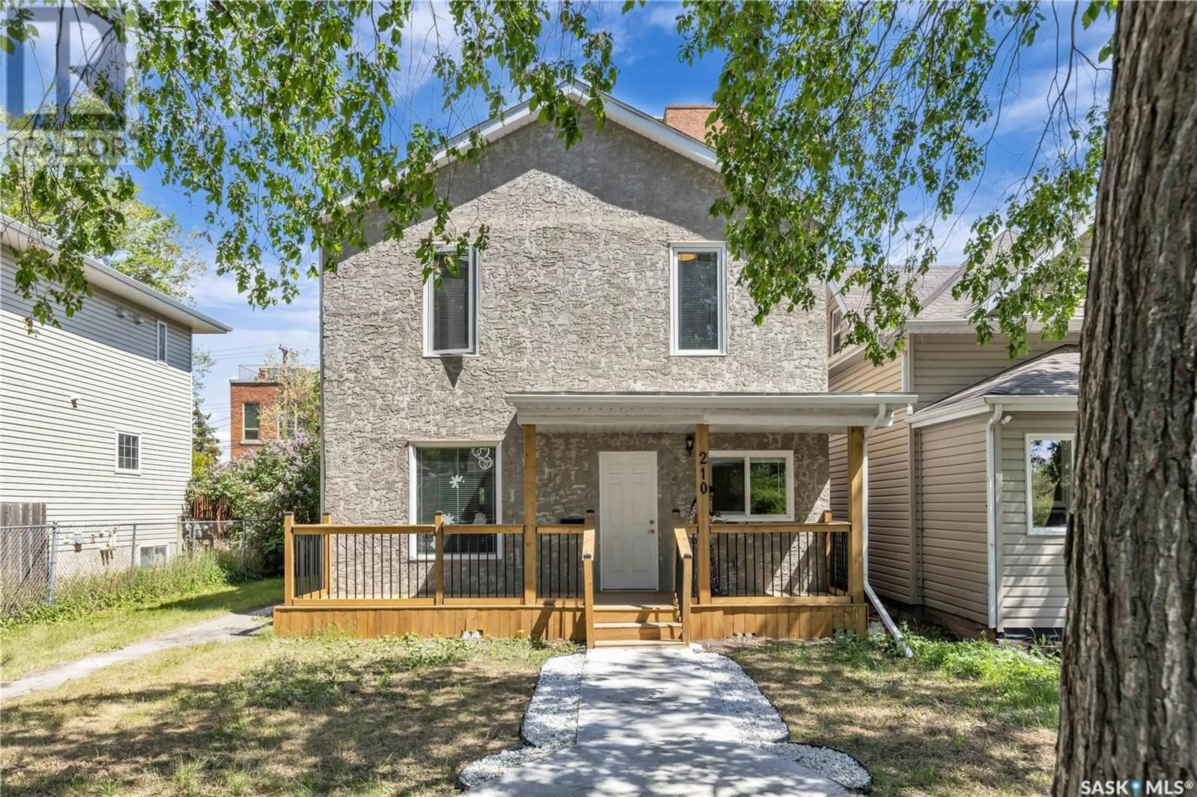 Home with brick exterior material, street for 210 E AVENUE N, Saskatoon Saskatchewan S7L1R7