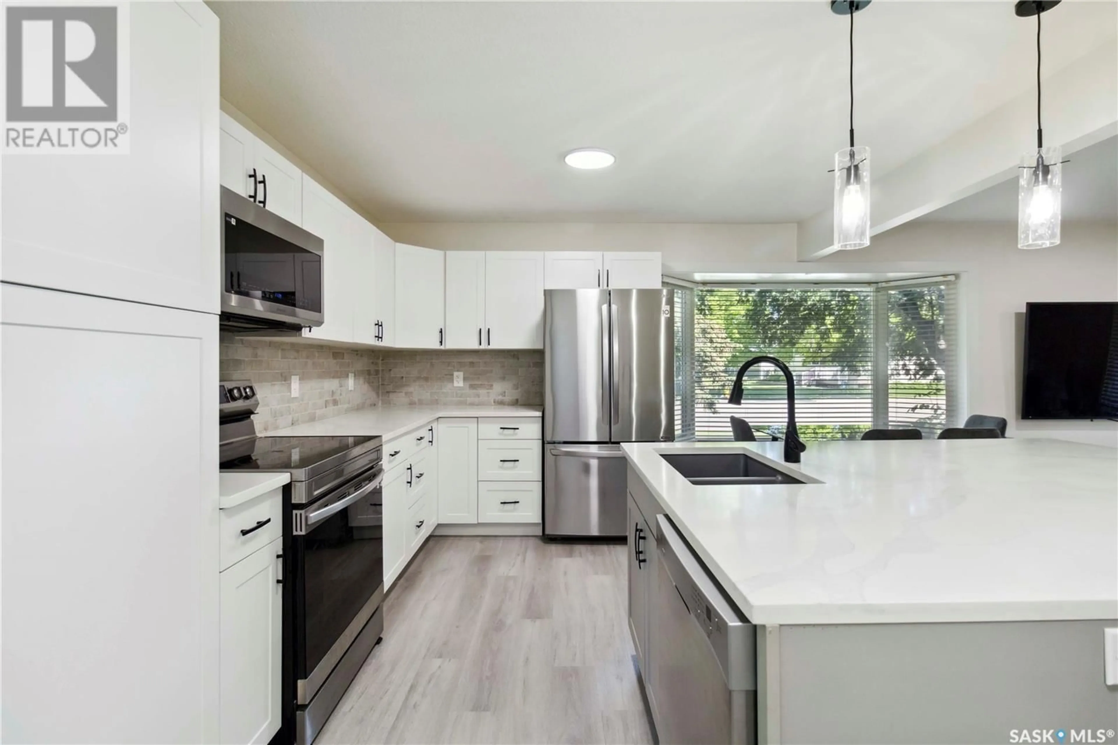 Open concept kitchen, ceramic/tile floor for 2534 EASTVIEW, Saskatoon Saskatchewan S7J3G6