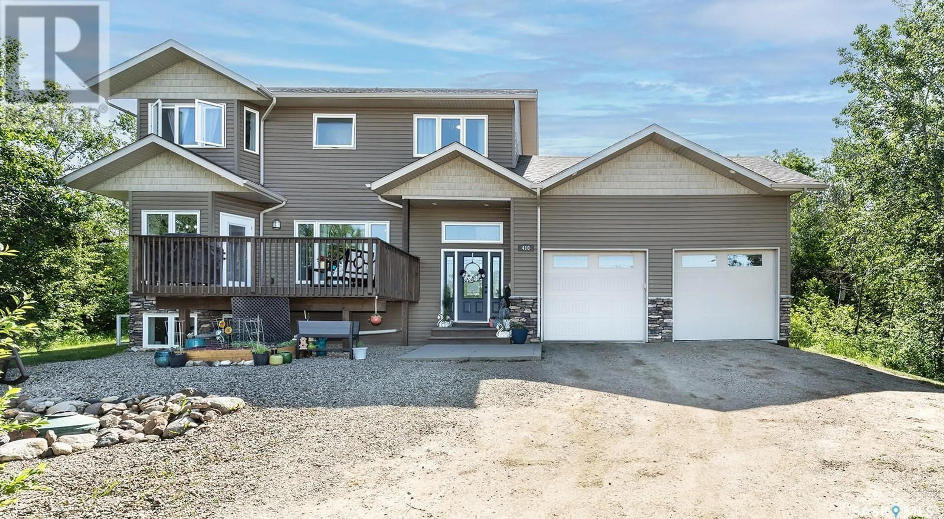 Home with vinyl exterior material, street for 410 SASKATCHEWAN ROAD, Laird Rm No. 404 Saskatchewan S0K2L0