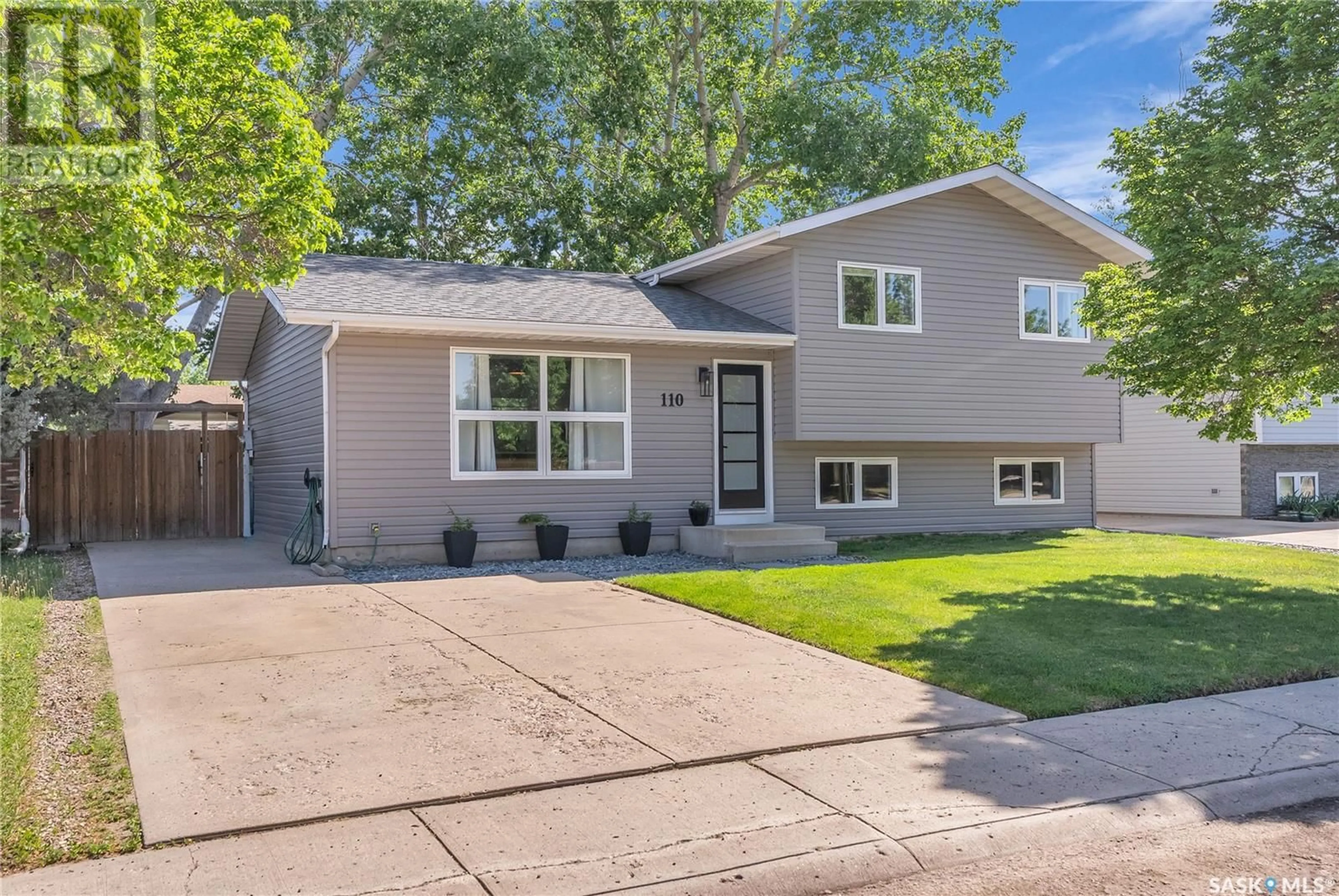 Home with vinyl exterior material, street for 110 WAKABAYASHI CRESCENT, Saskatoon Saskatchewan S7K7L8