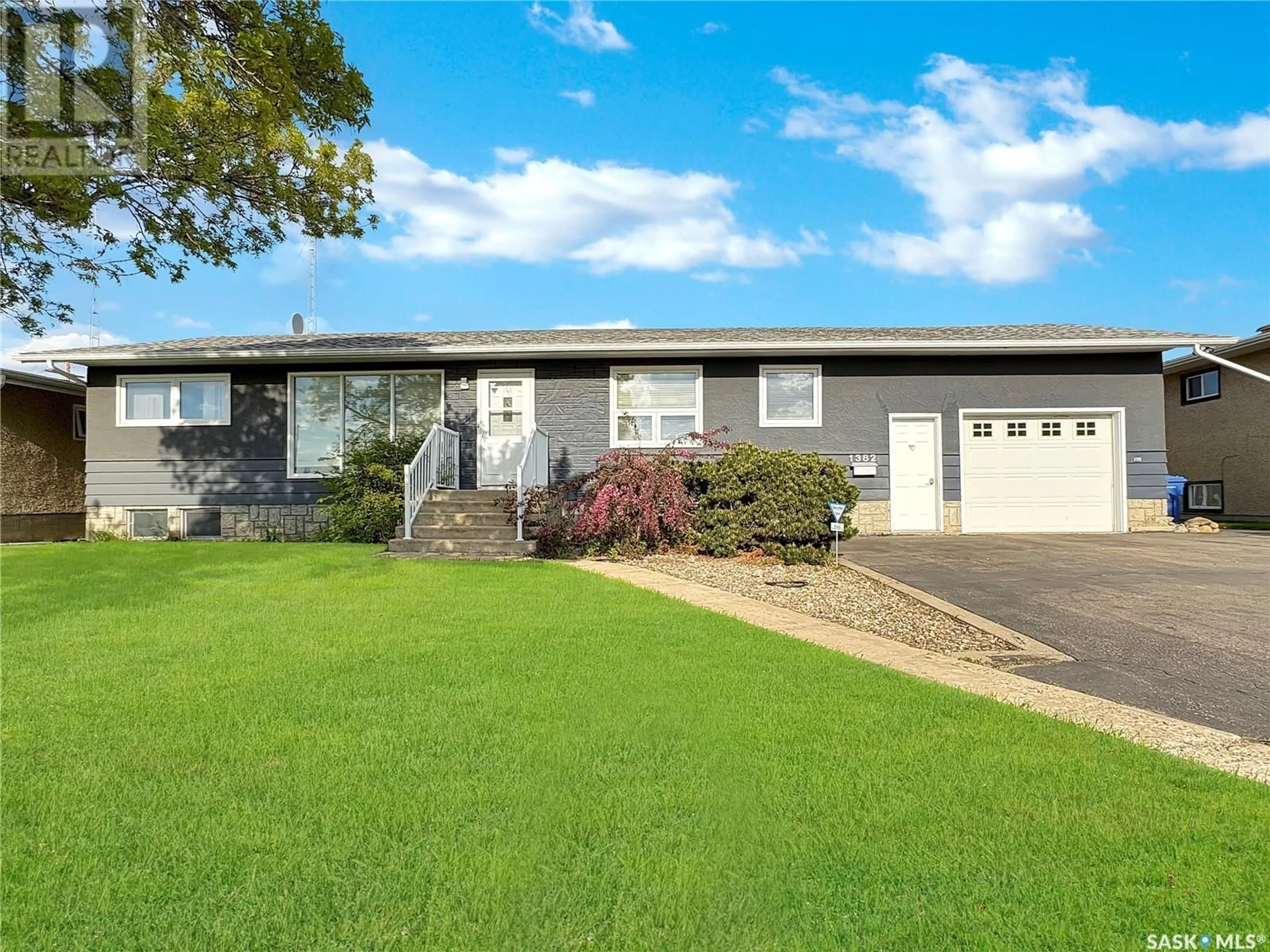 Home with vinyl exterior material, street for 1382 112TH STREET, North Battleford Saskatchewan S9A2G1