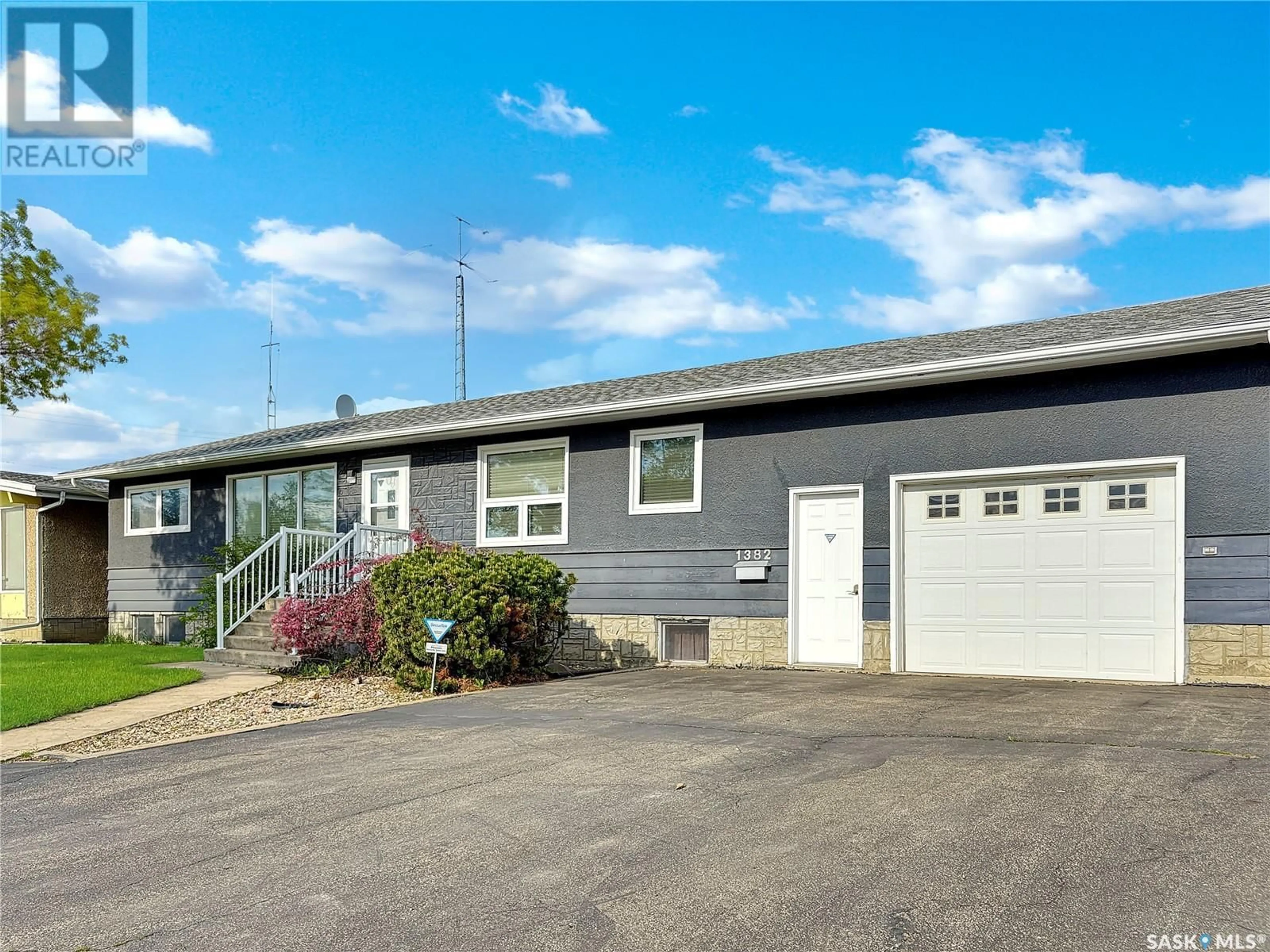 Home with vinyl exterior material, street for 1382 112TH STREET, North Battleford Saskatchewan S9A2G1