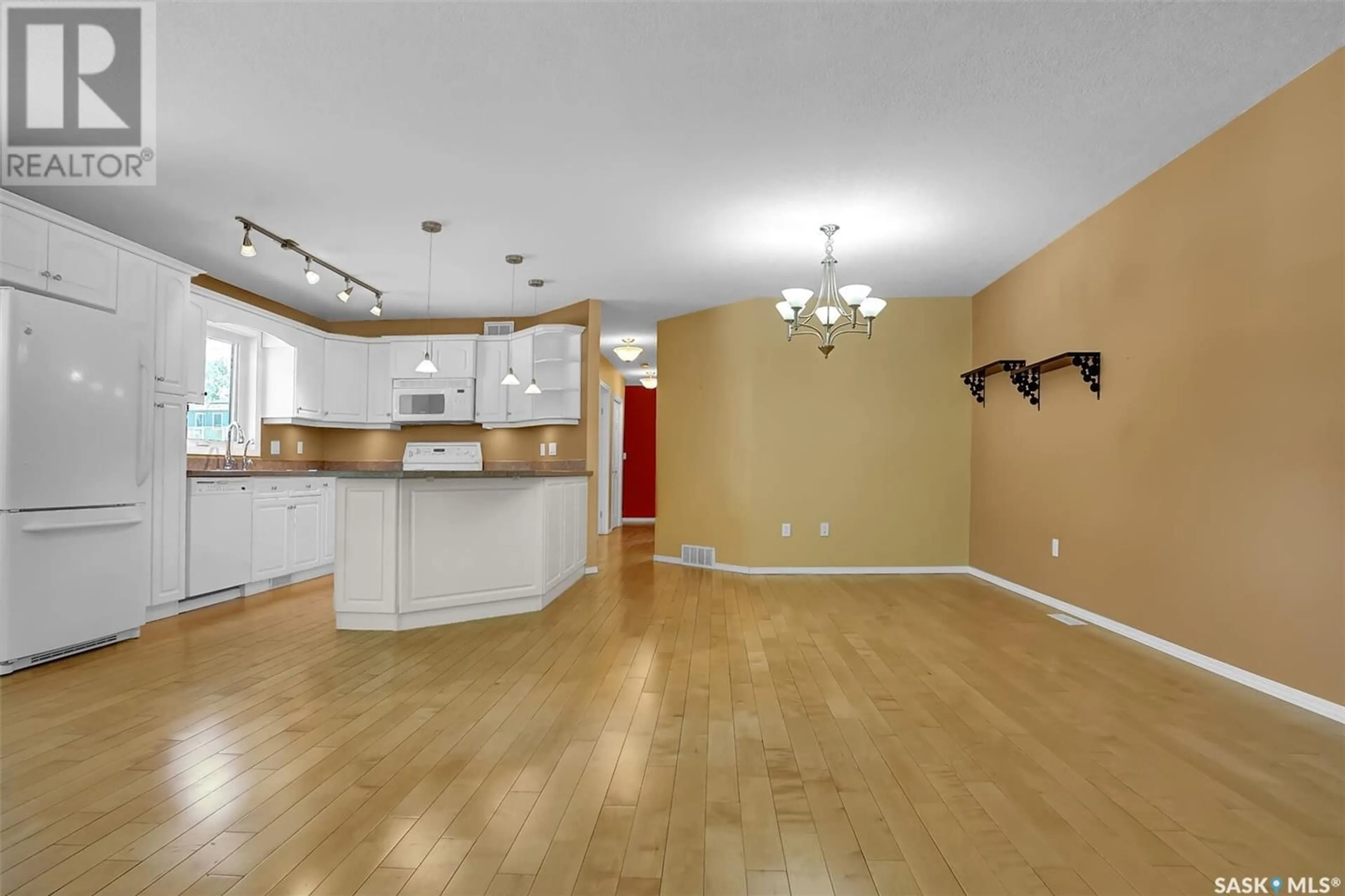 Open concept kitchen, wood/laminate floor for 2701 MCDONALD STREET, Regina Saskatchewan S4N2Z9