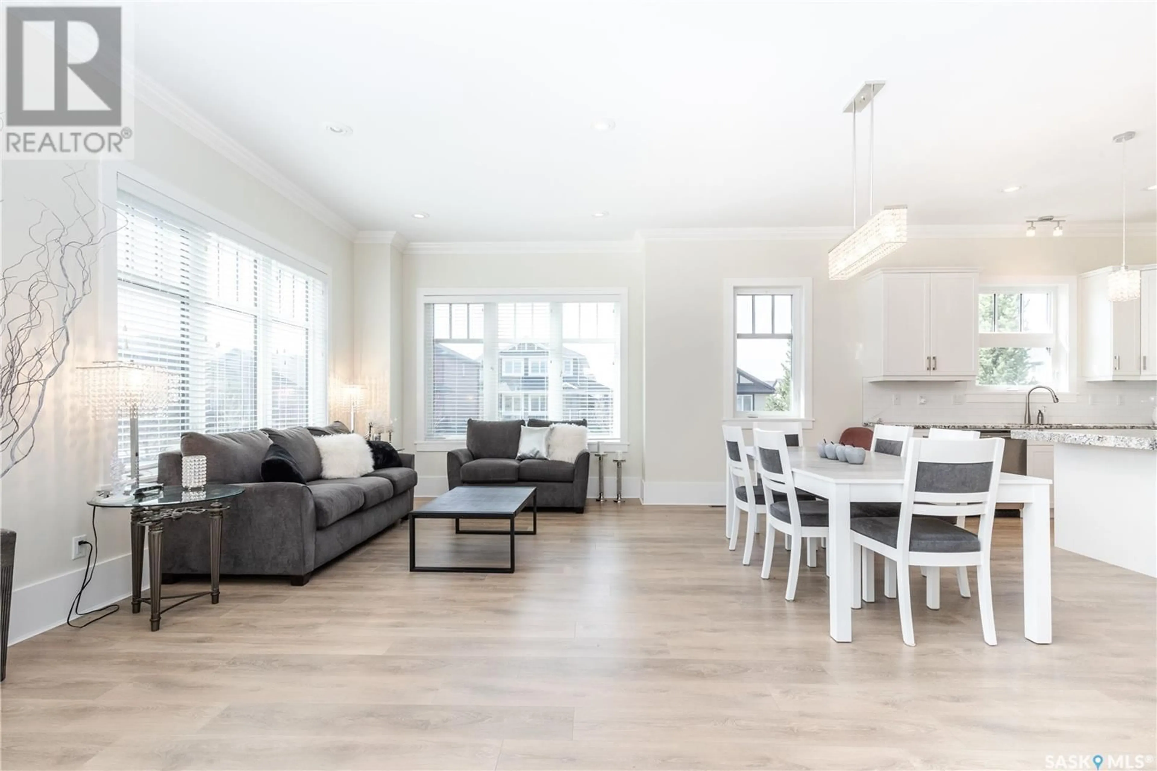 Living room with furniture, wood/laminate floor for 32 115 MEADOWS BOULEVARD, Saskatoon Saskatchewan S7V0E6