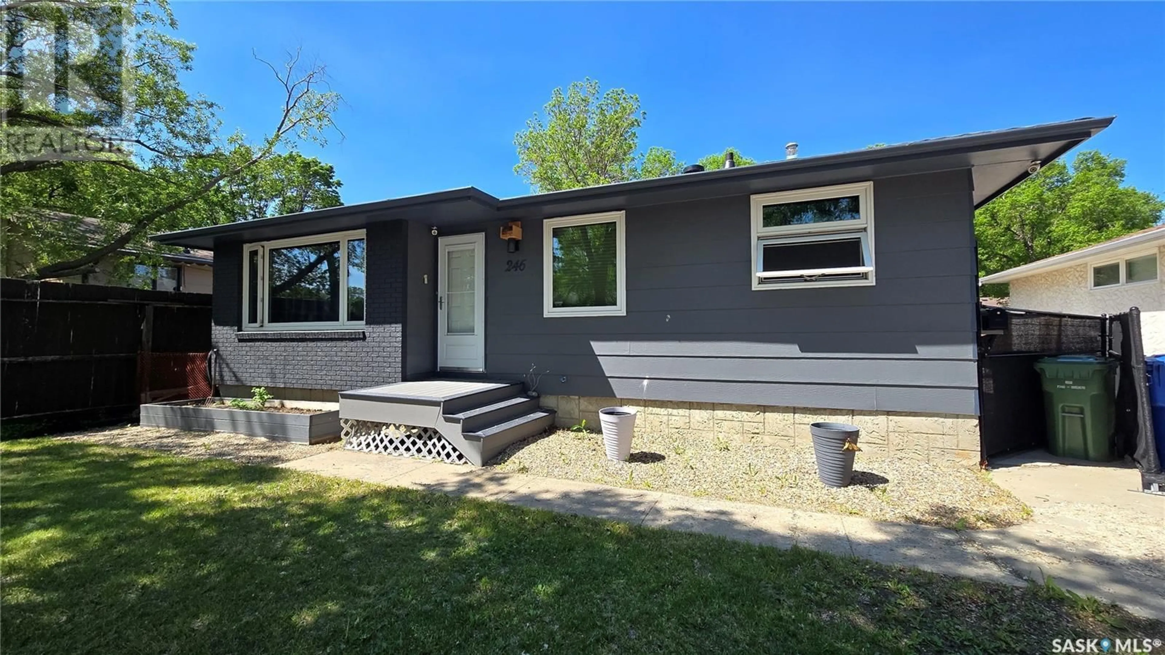 Home with vinyl exterior material, street for 246 WELLS STREET, Regina Saskatchewan S4R6T2