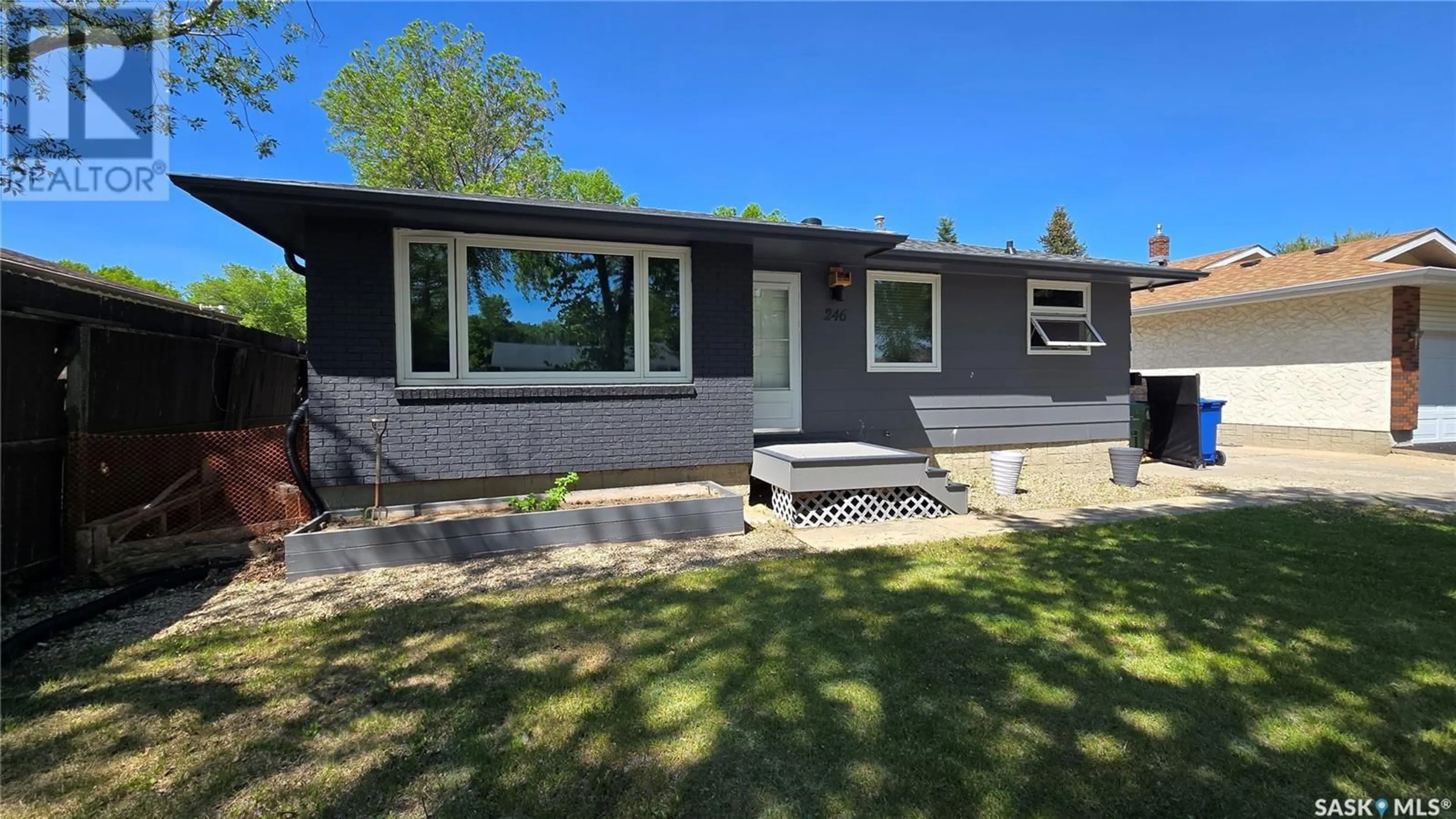 Home with vinyl exterior material, street for 246 WELLS STREET, Regina Saskatchewan S4R6T2