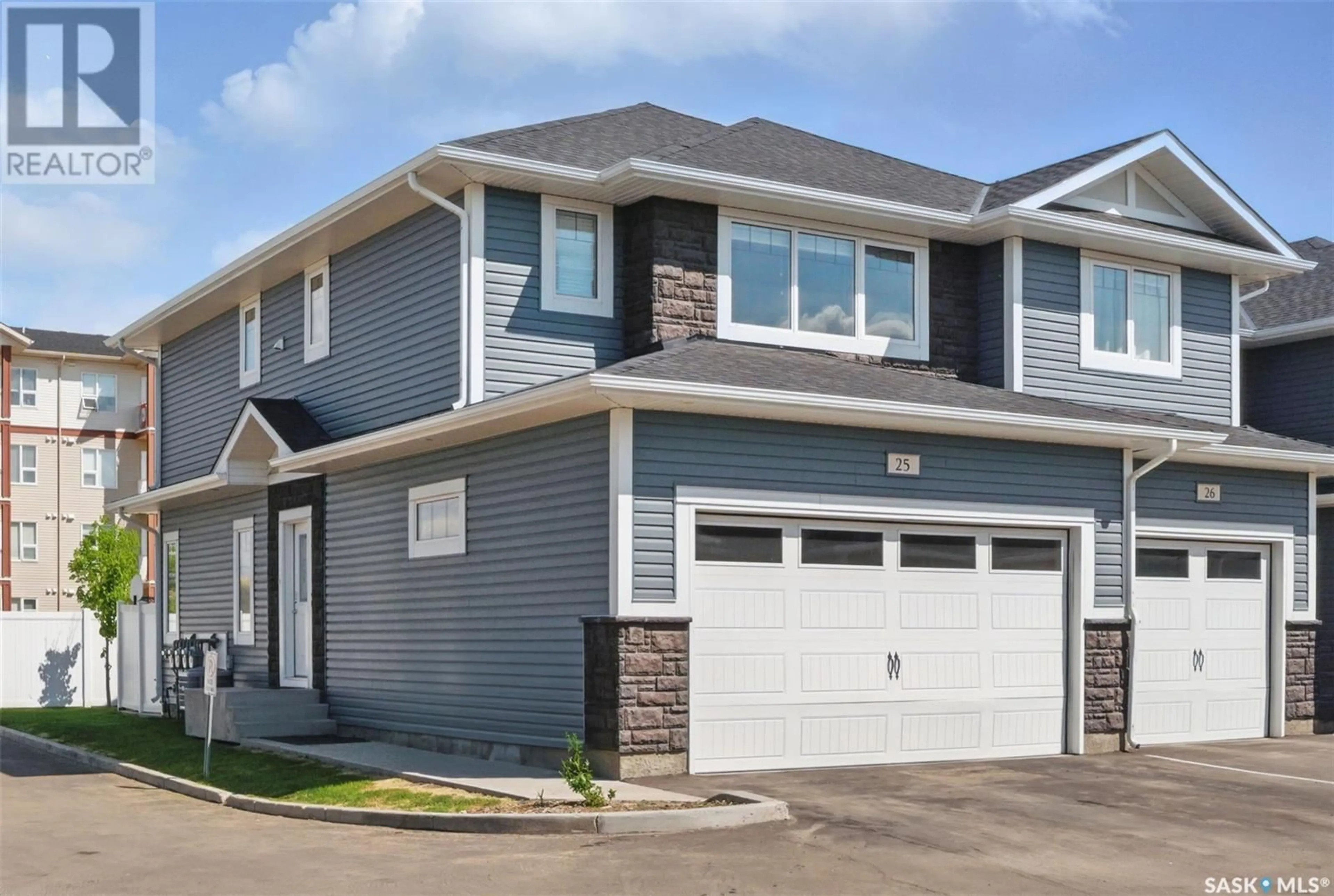 Home with vinyl exterior material, street for 25 115 VELTKAMP CRESCENT, Saskatoon Saskatchewan S7T0T7