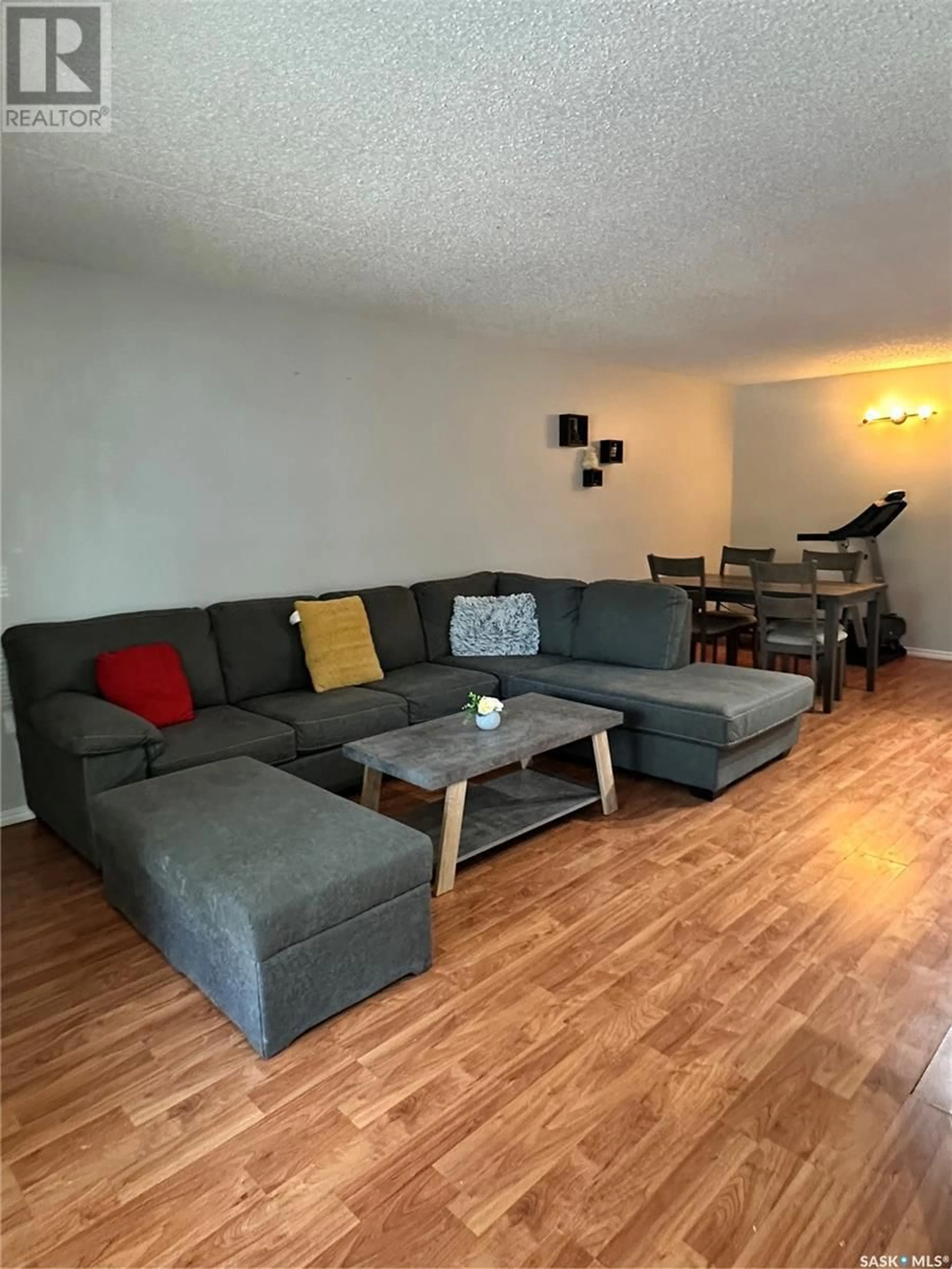 Living room with furniture, wood/laminate floor for 40 GORE PLACE, Regina Saskatchewan S4T7S4
