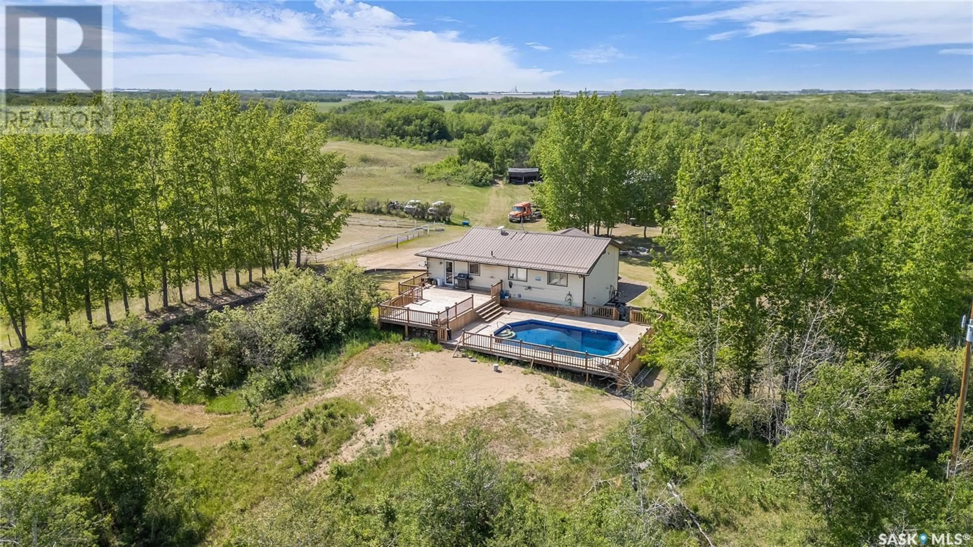 A pic from outside/outdoor area/front of a property/back of a property/a pic from drone, water/lake/river/ocean view for 3070 - 35322 RANGE ROAD, Vanscoy Rm No. 345 Saskatchewan S7K3J6