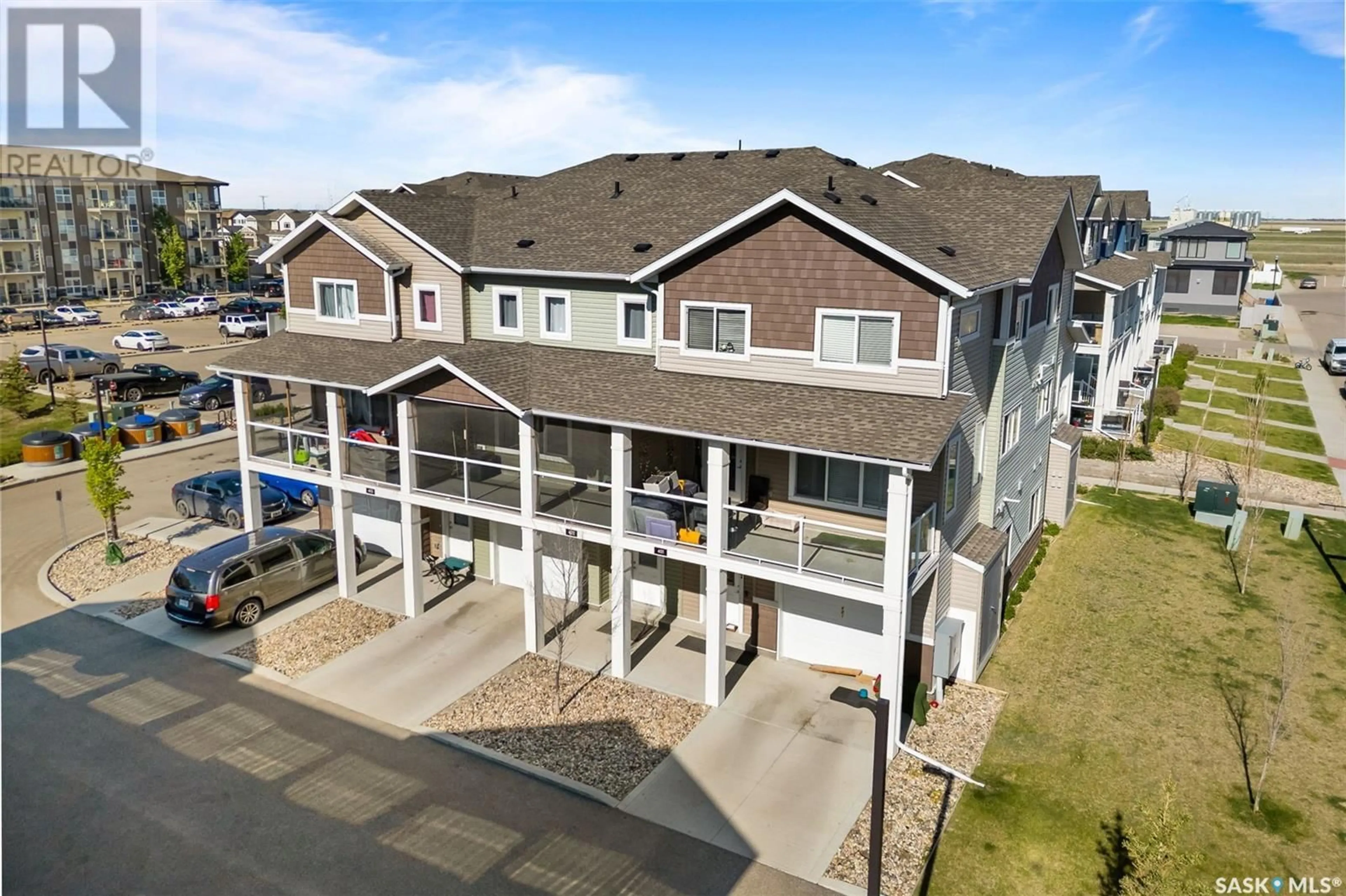 A pic from outside/outdoor area/front of a property/back of a property/a pic from drone, water/lake/river/ocean view for 402 - 3363 GREEN POPPY STREET, Regina Saskatchewan S4V3K5