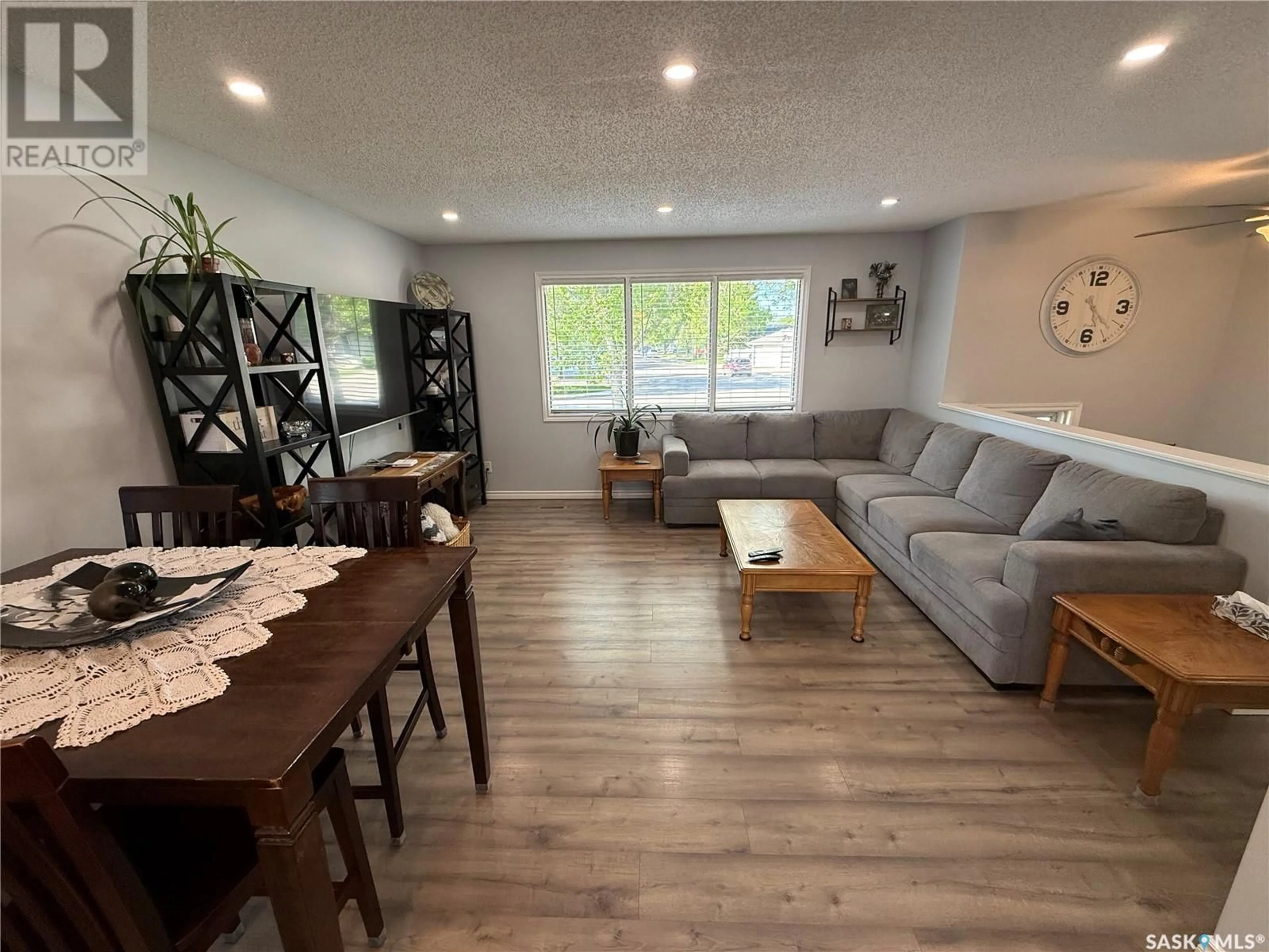 Living room with furniture, wood/laminate floor for 175 CHURCH DRIVE, Regina Saskatchewan S4X1R8