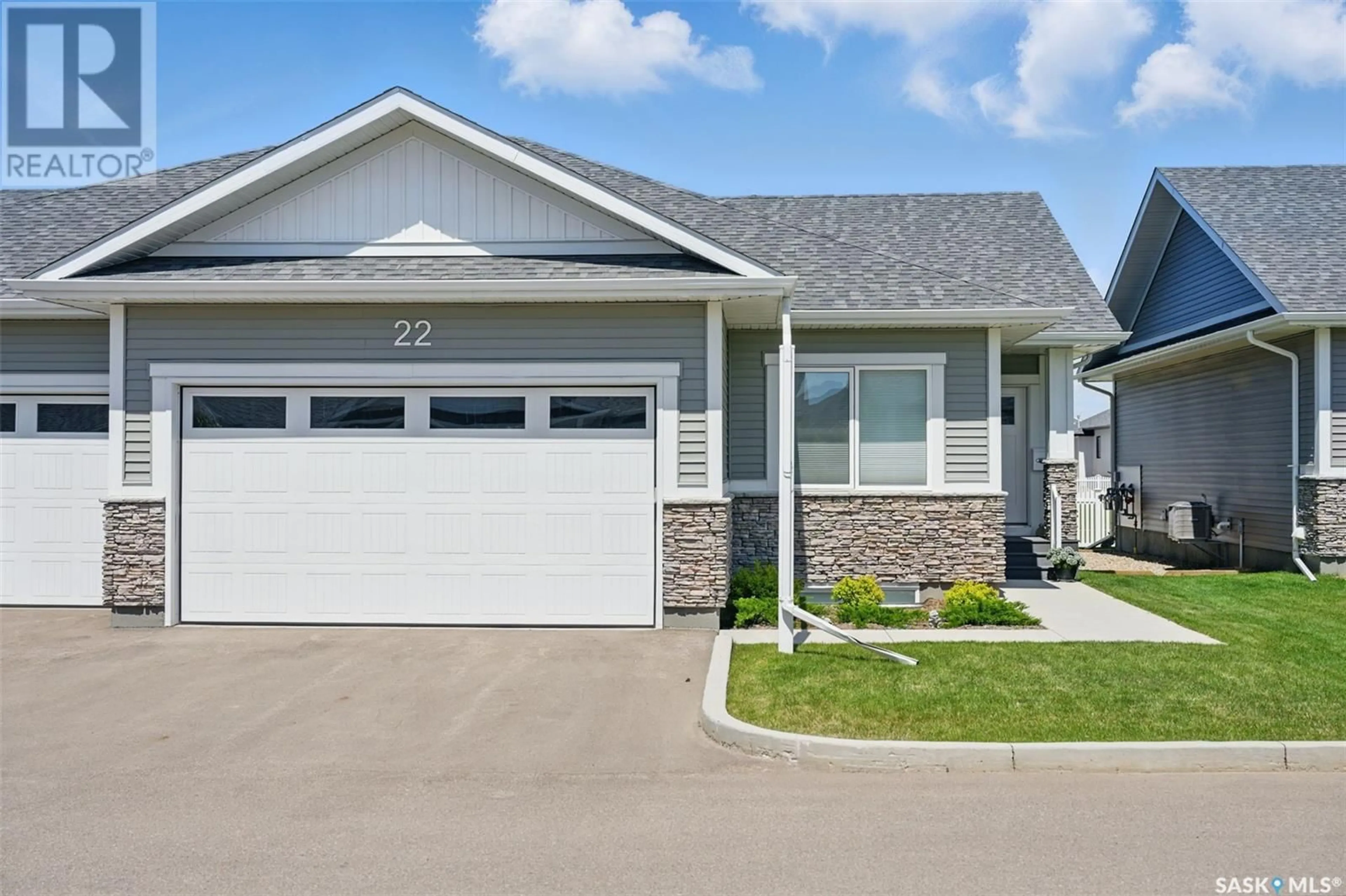 Home with vinyl exterior material, street for 22 437 PALMER CRESCENT, Warman Saskatchewan S0K4S1