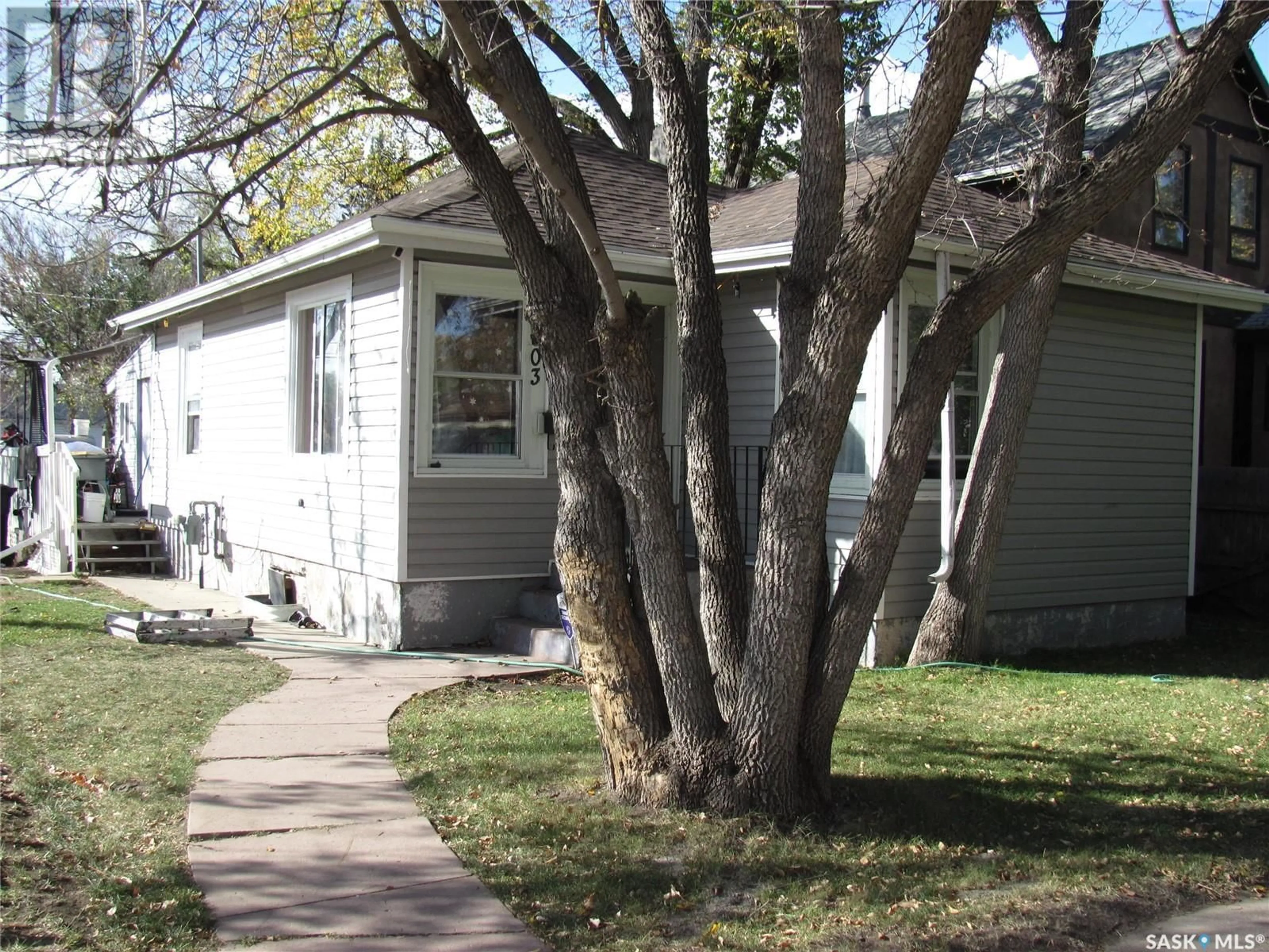 Home with vinyl exterior material, street for 803 I AVENUE, Saskatoon Saskatchewan S7L2H2