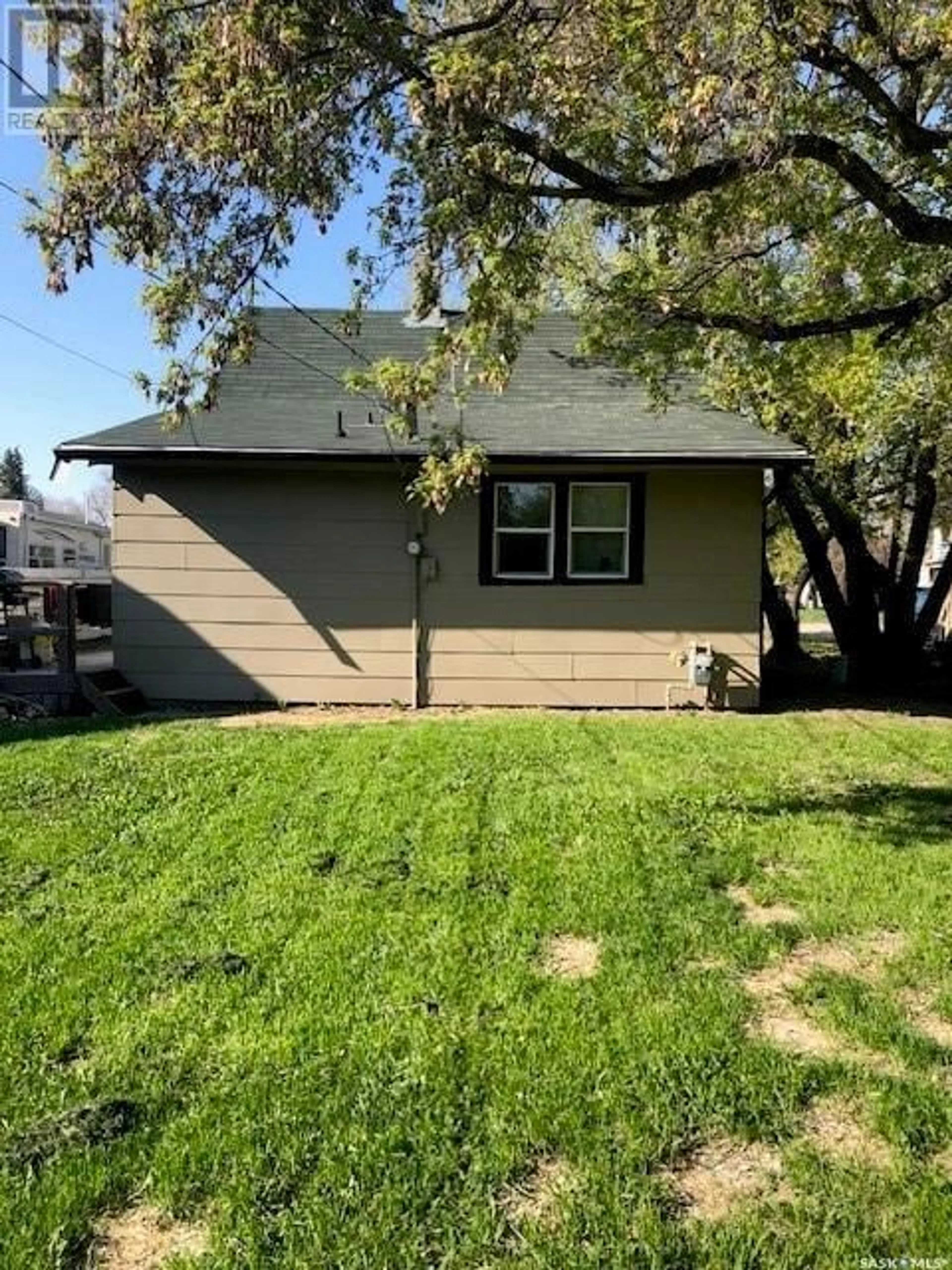 Home with vinyl exterior material, street for E - 110 4TH AVENUE, Watrous Saskatchewan S0K4T0