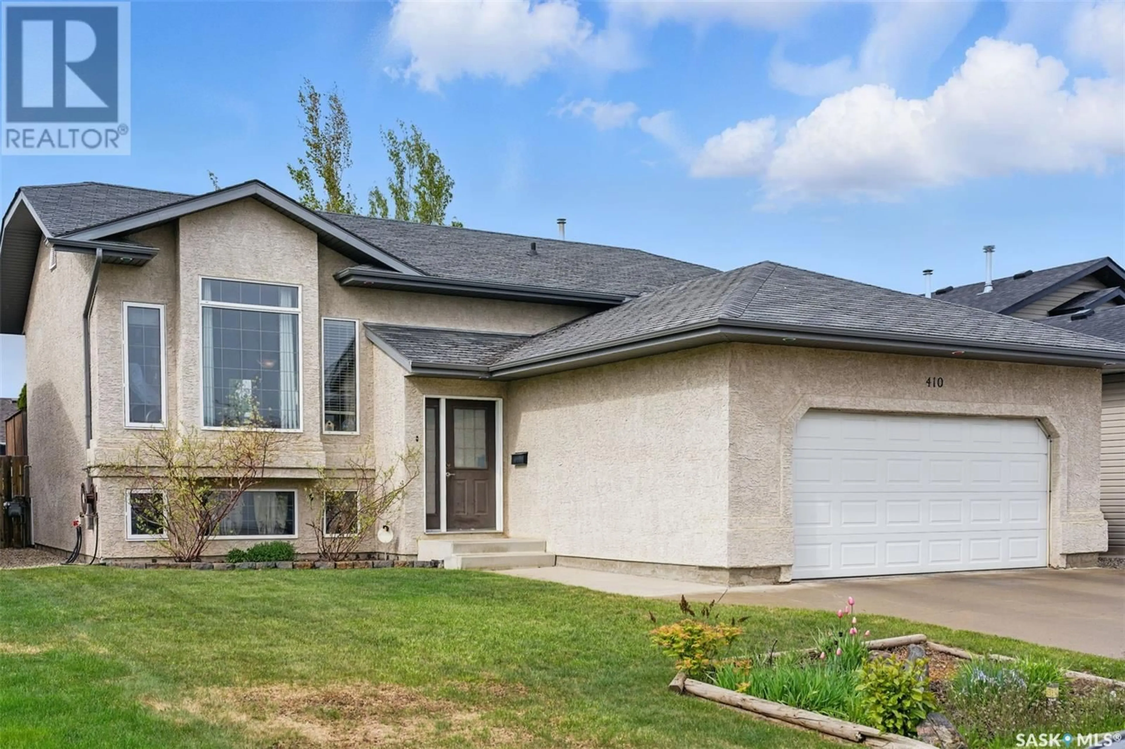 Home with vinyl exterior material, street for 410 CRYSTAL CRESCENT, Warman Saskatchewan S0K0A1