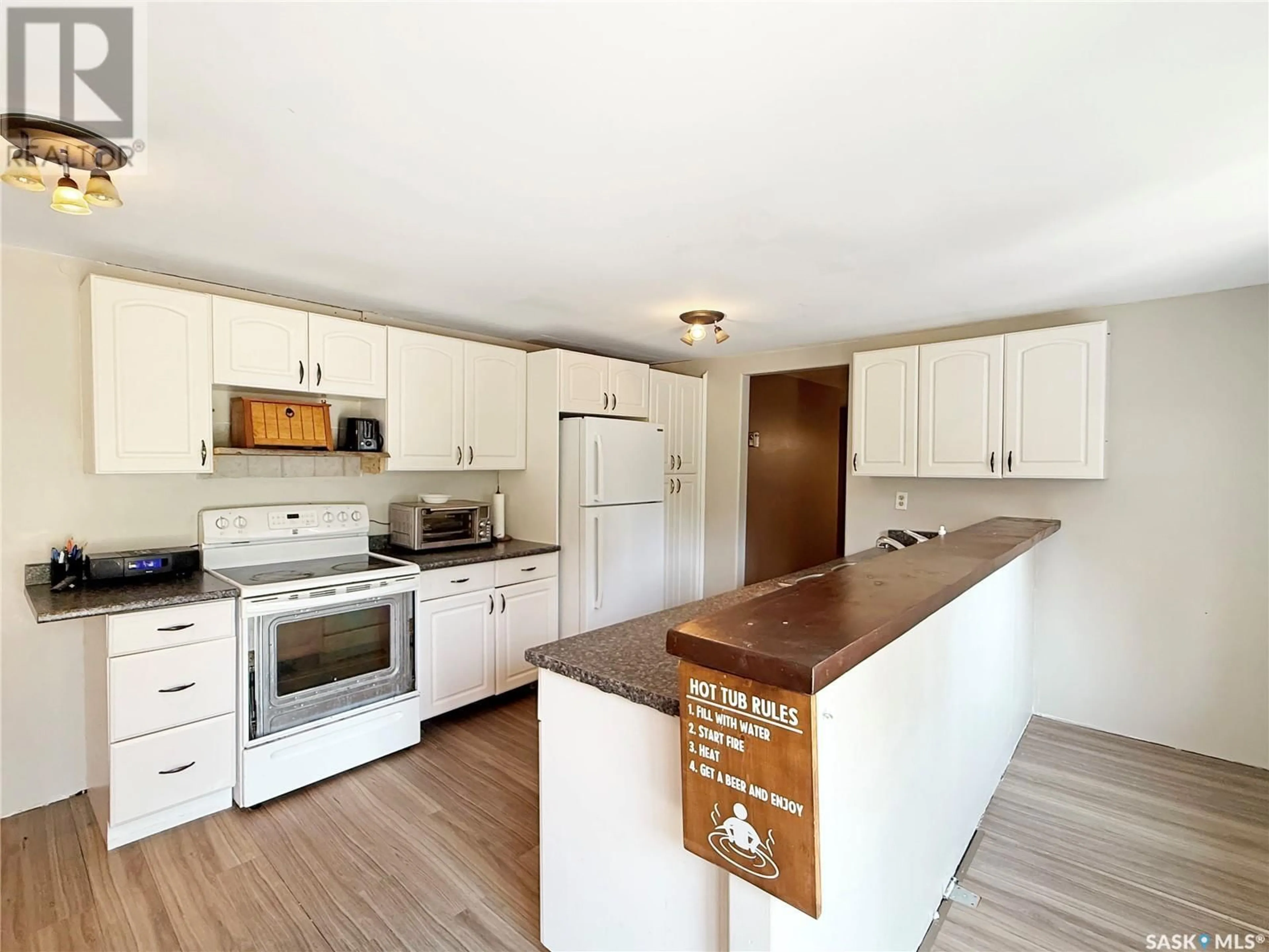 Open concept kitchen, wood/laminate floor for 14 FAIRWAY DRIVE, Candle Lake Saskatchewan S0J3E0