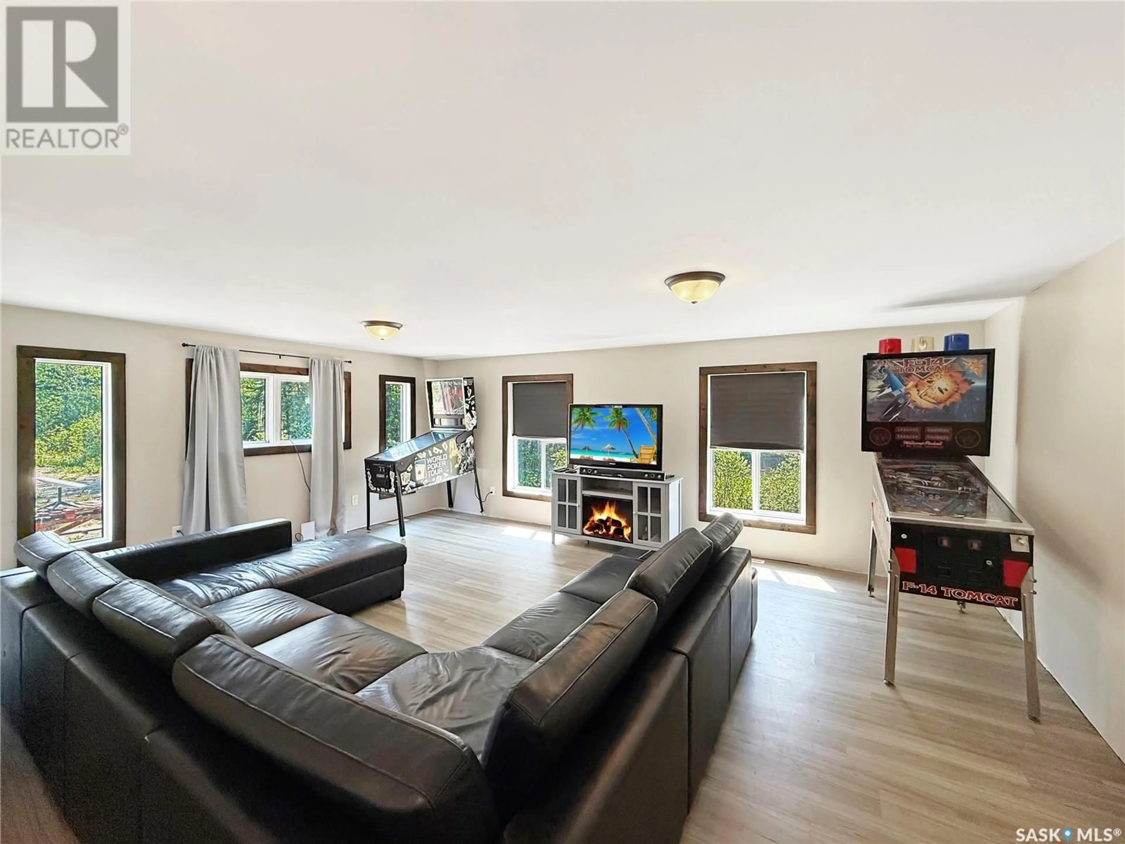 Living room with furniture, wood/laminate floor for 14 FAIRWAY DRIVE, Candle Lake Saskatchewan S0J3E0