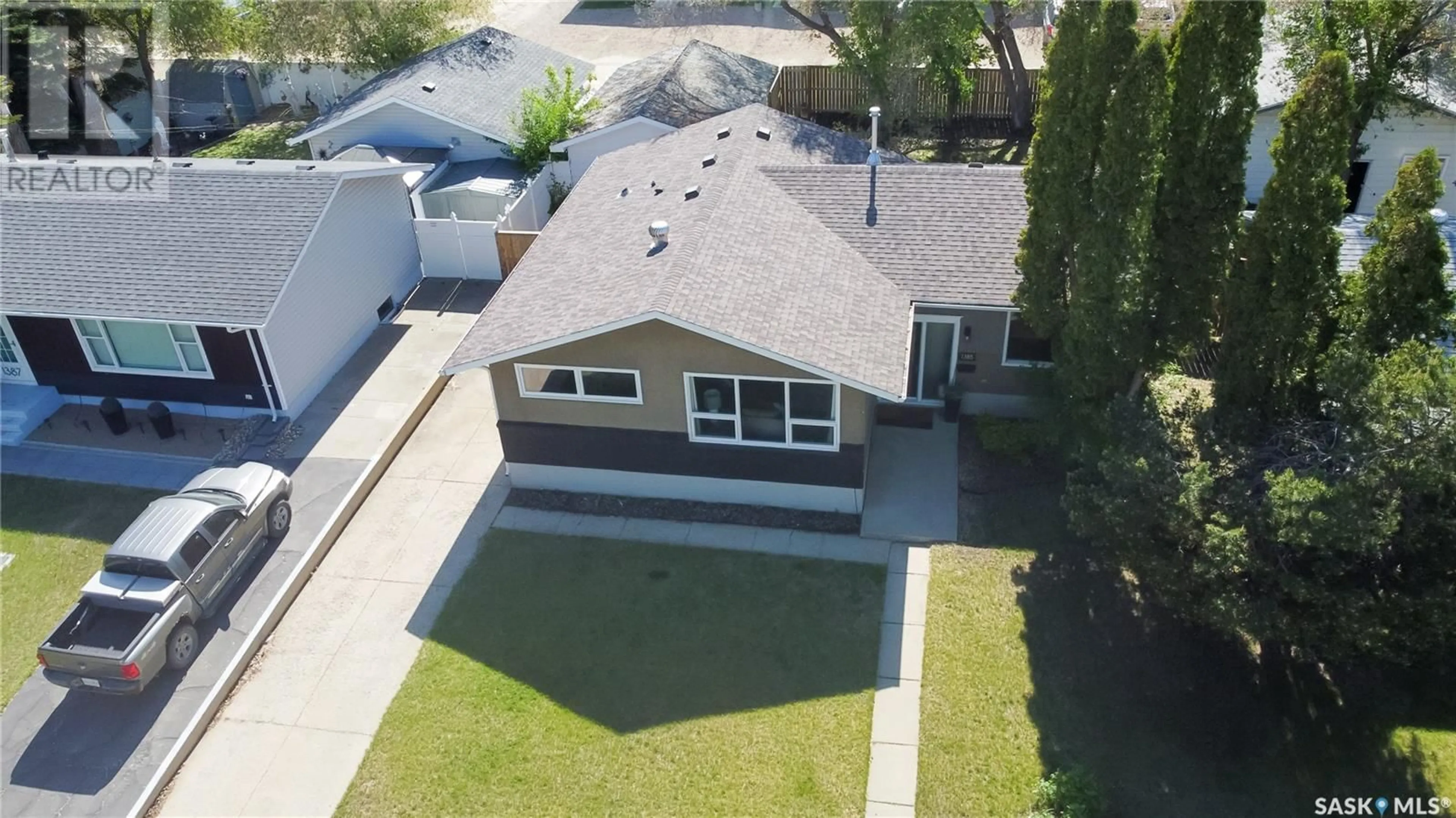 A pic from outside/outdoor area/front of a property/back of a property/a pic from drone, water/lake/river/ocean view for 1385 QUEEN CRESCENT, Moose Jaw Saskatchewan S6H3G5