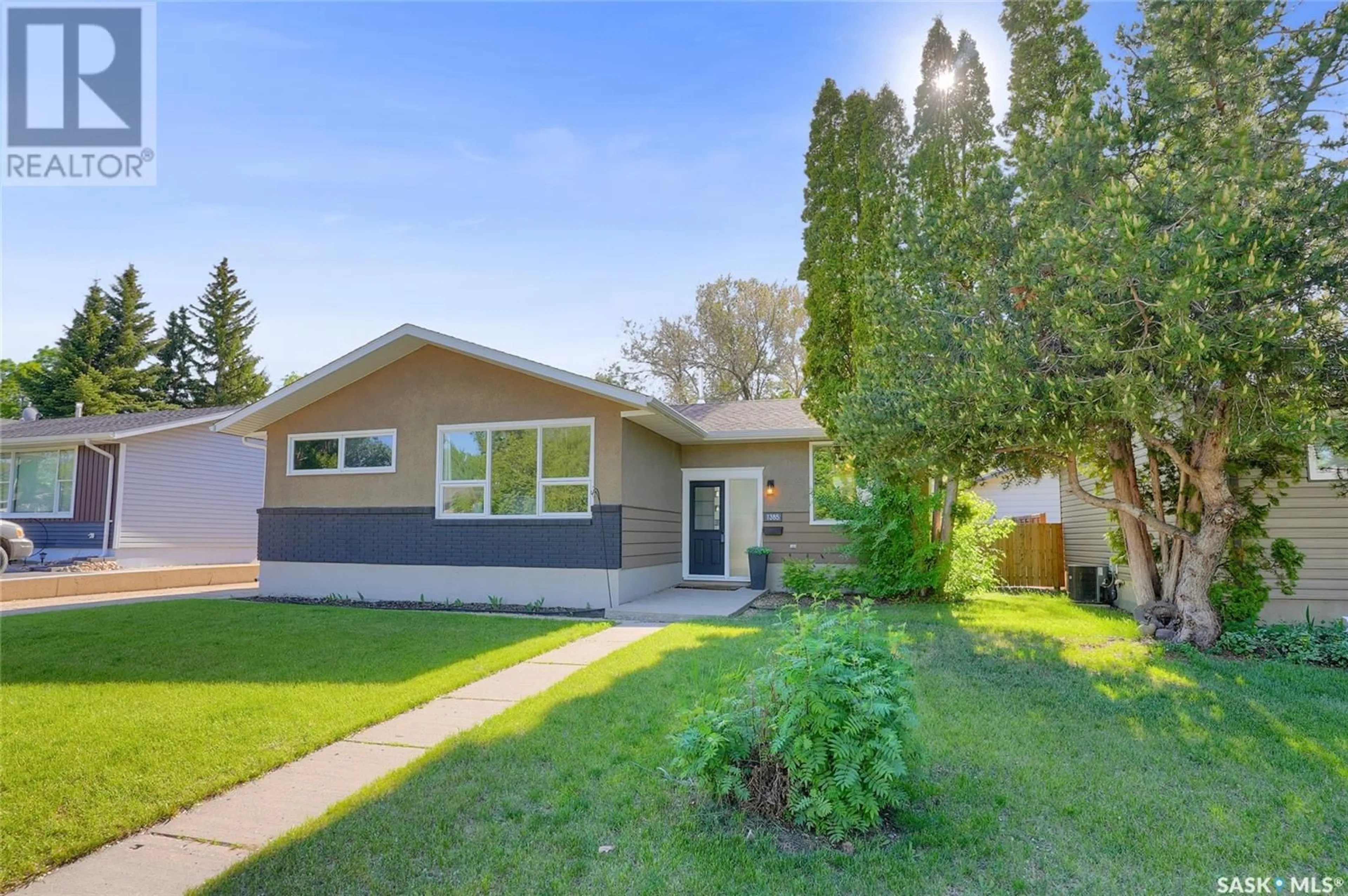 Home with vinyl exterior material, street for 1385 QUEEN CRESCENT, Moose Jaw Saskatchewan S6H3G5