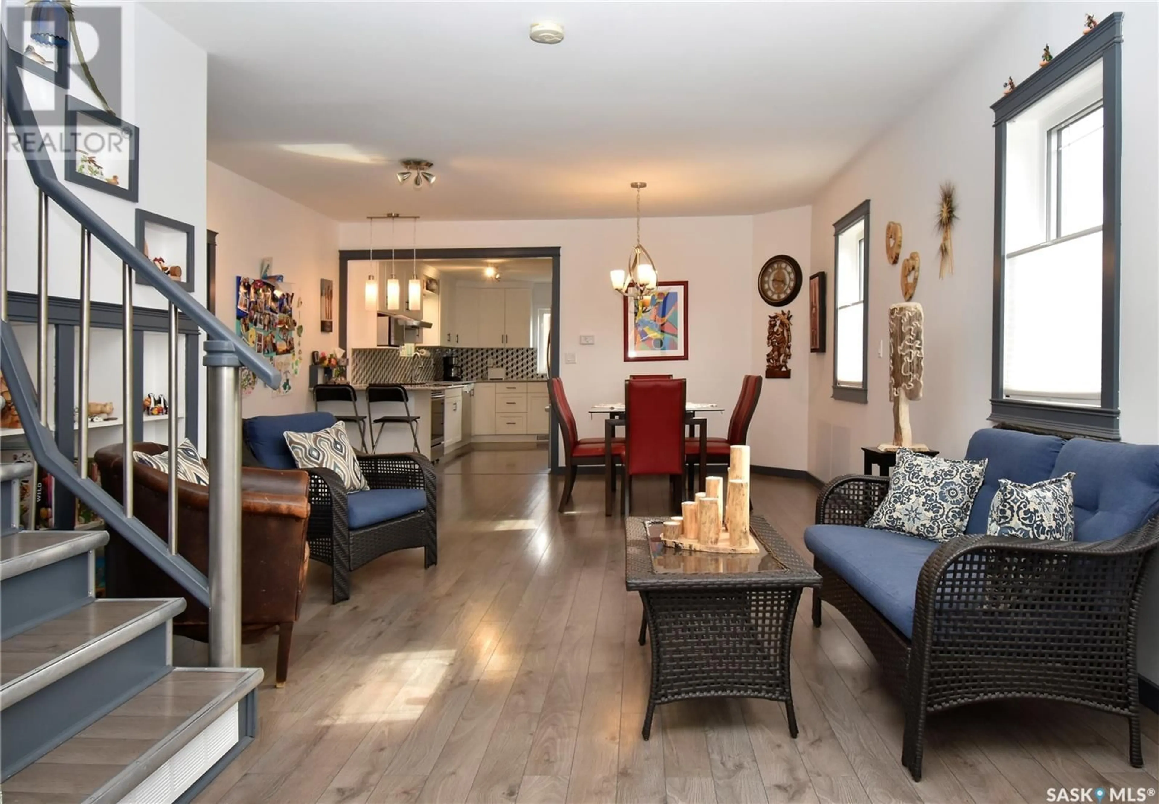 Living room with furniture, wood/laminate floor for 1417 SECOND STREET, Estevan Saskatchewan S4A0M5