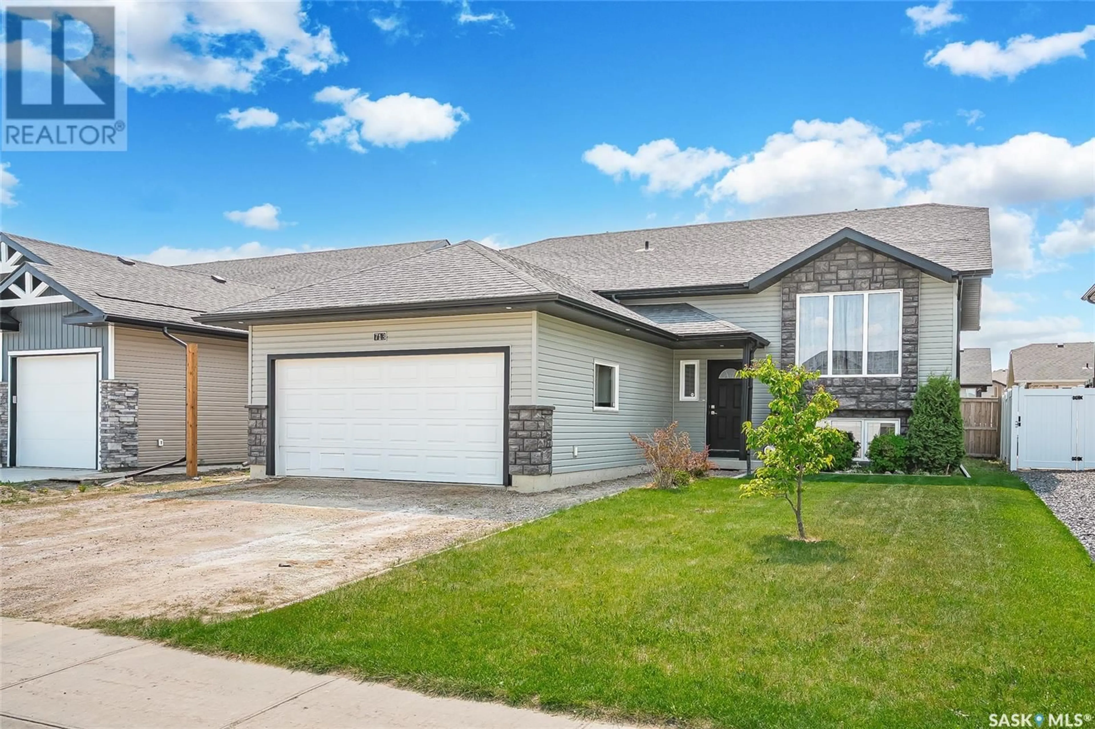 Home with vinyl exterior material, street for 713 SARAZEN DRIVE, Warman Saskatchewan S0K4S4