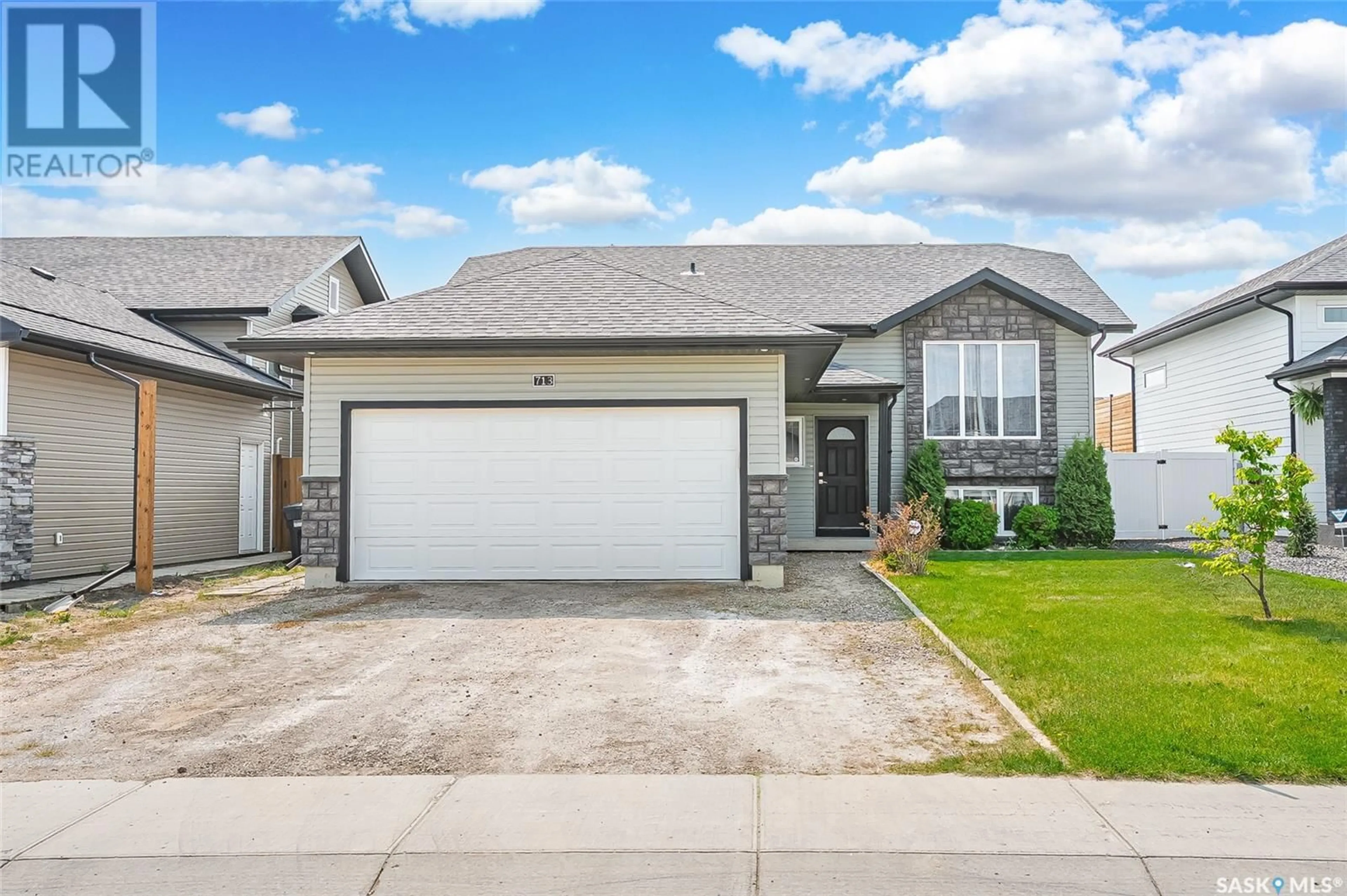 Home with vinyl exterior material, street for 713 SARAZEN DRIVE, Warman Saskatchewan S0K4S4