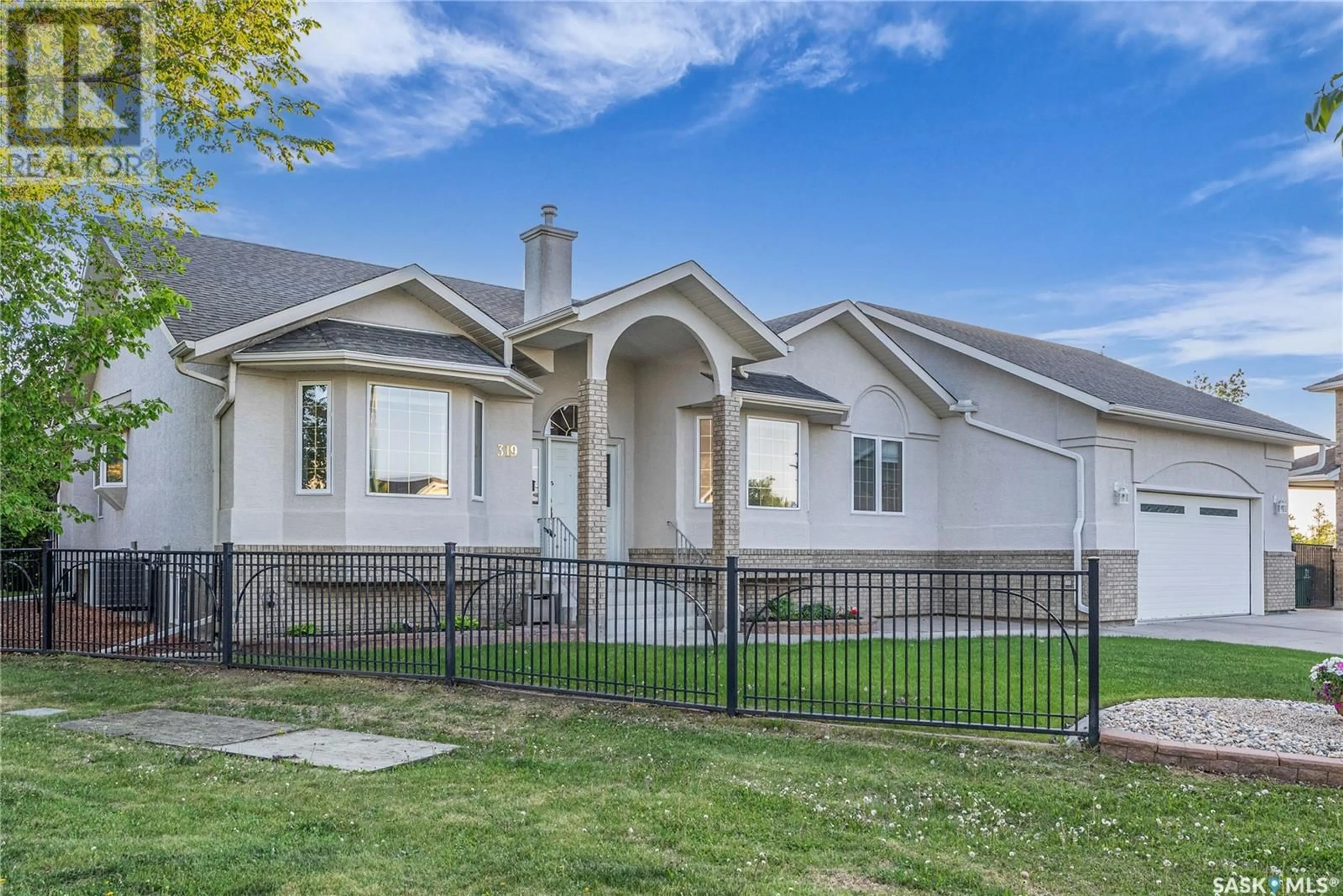 Home with vinyl exterior material, street for 319 BROOKMORE CRESCENT, Saskatoon Saskatchewan S7V1C1