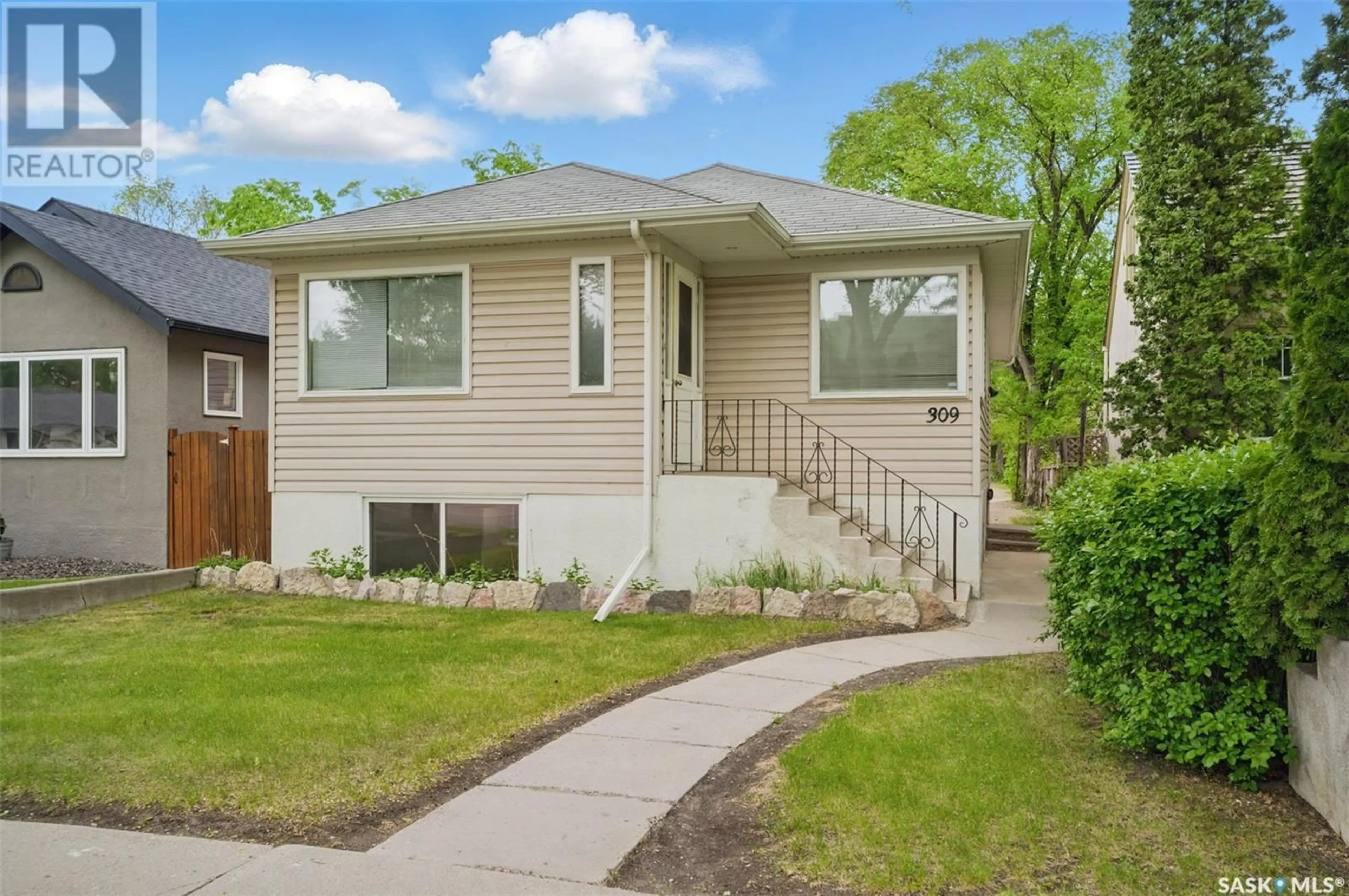 Home with vinyl exterior material, street for 309 BOTTOMLEY AVENUE, Saskatoon Saskatchewan S7N1L3