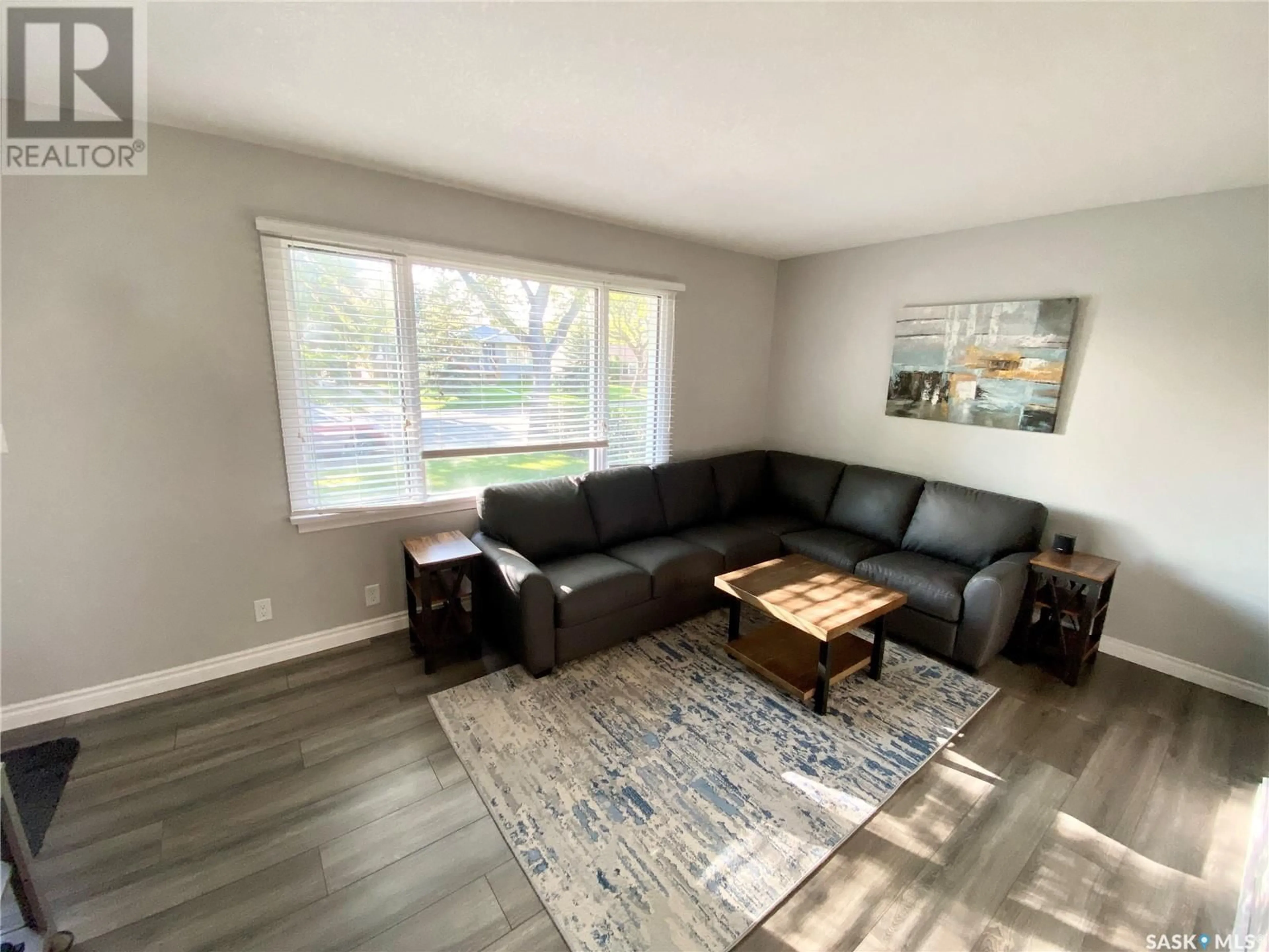 Living room with furniture, wood/laminate floor for 741 ROYAL STREET, Regina Saskatchewan S4T4Z3