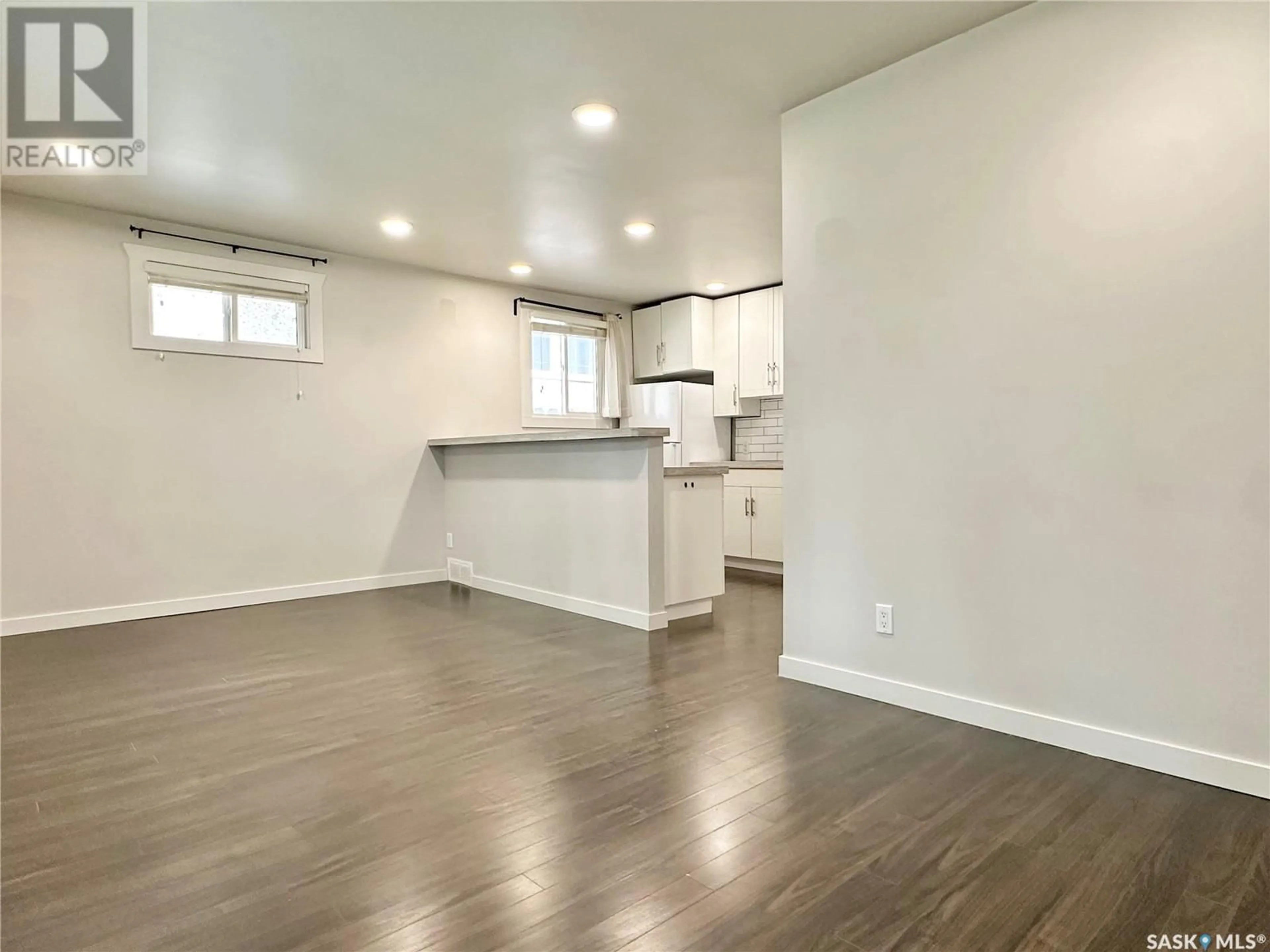 Open concept kitchen, wood/laminate floor for 1025 7TH STREET, Saskatoon Saskatchewan S7H0Y7