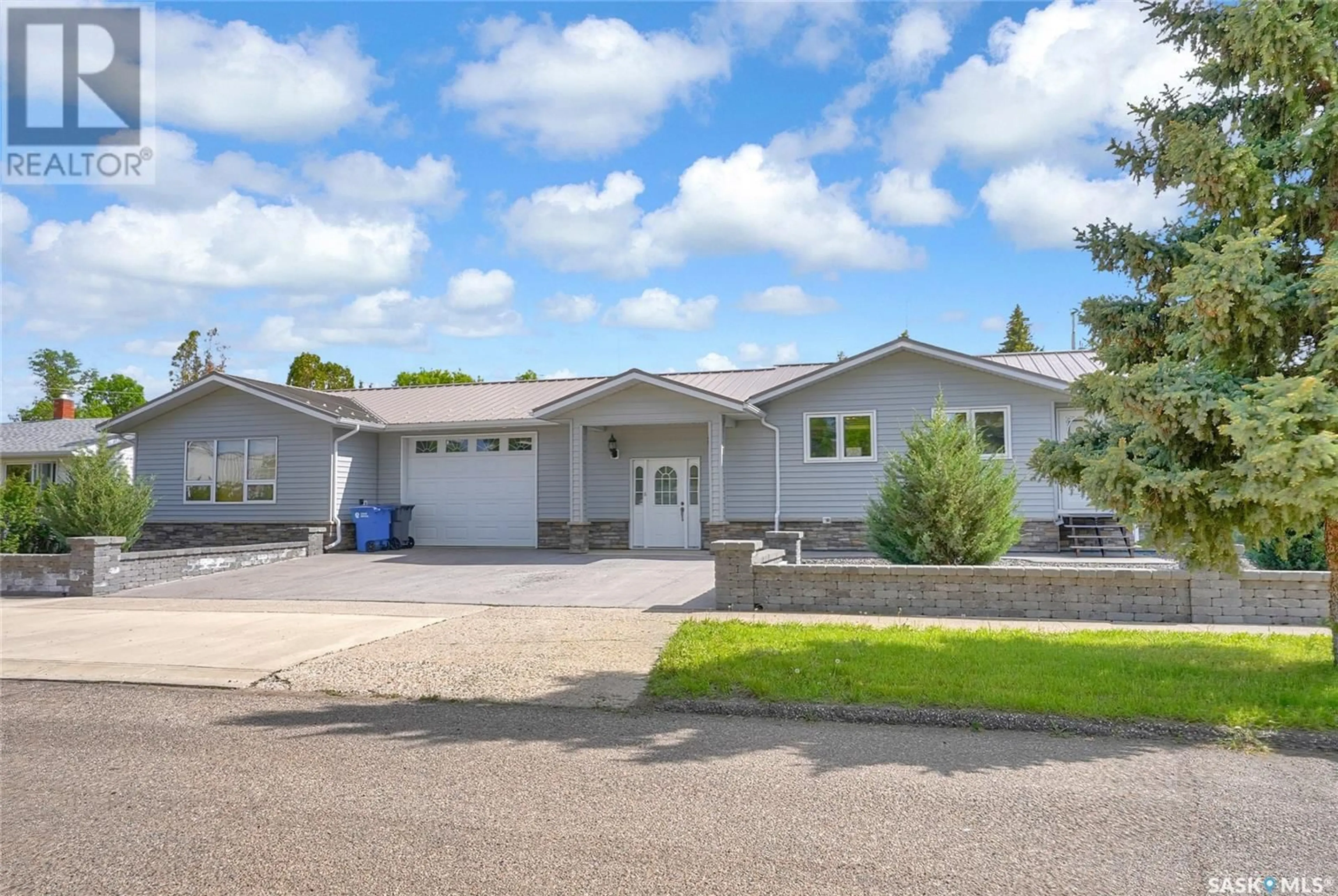 Home with vinyl exterior material, street for 110 3RD AVENUE, Gravelbourg Saskatchewan S0H1X0