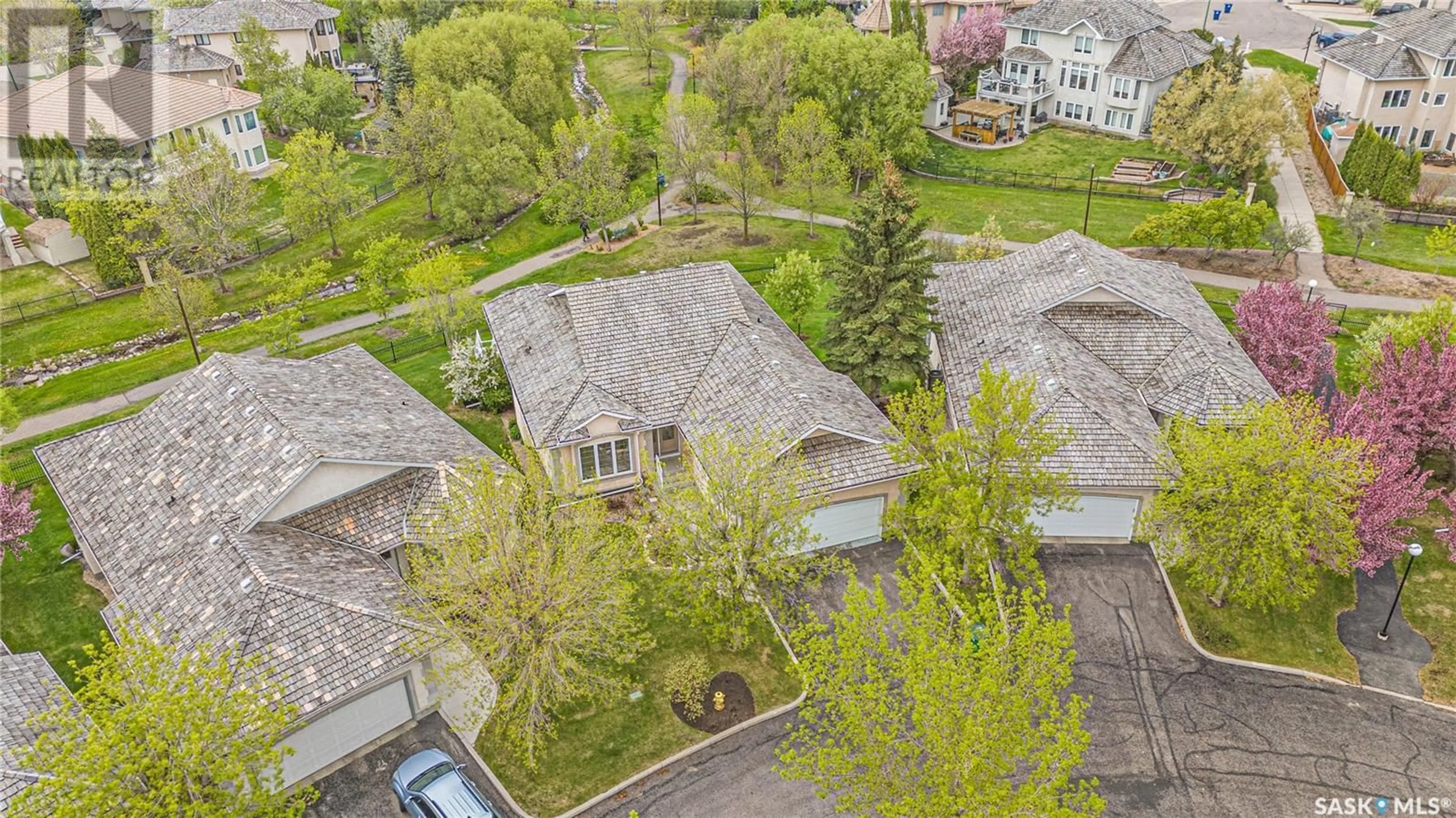 A pic from outside/outdoor area/front of a property/back of a property/a pic from drone, street for 6 330 STODOLA COURT, Saskatoon Saskatchewan S7N4N9