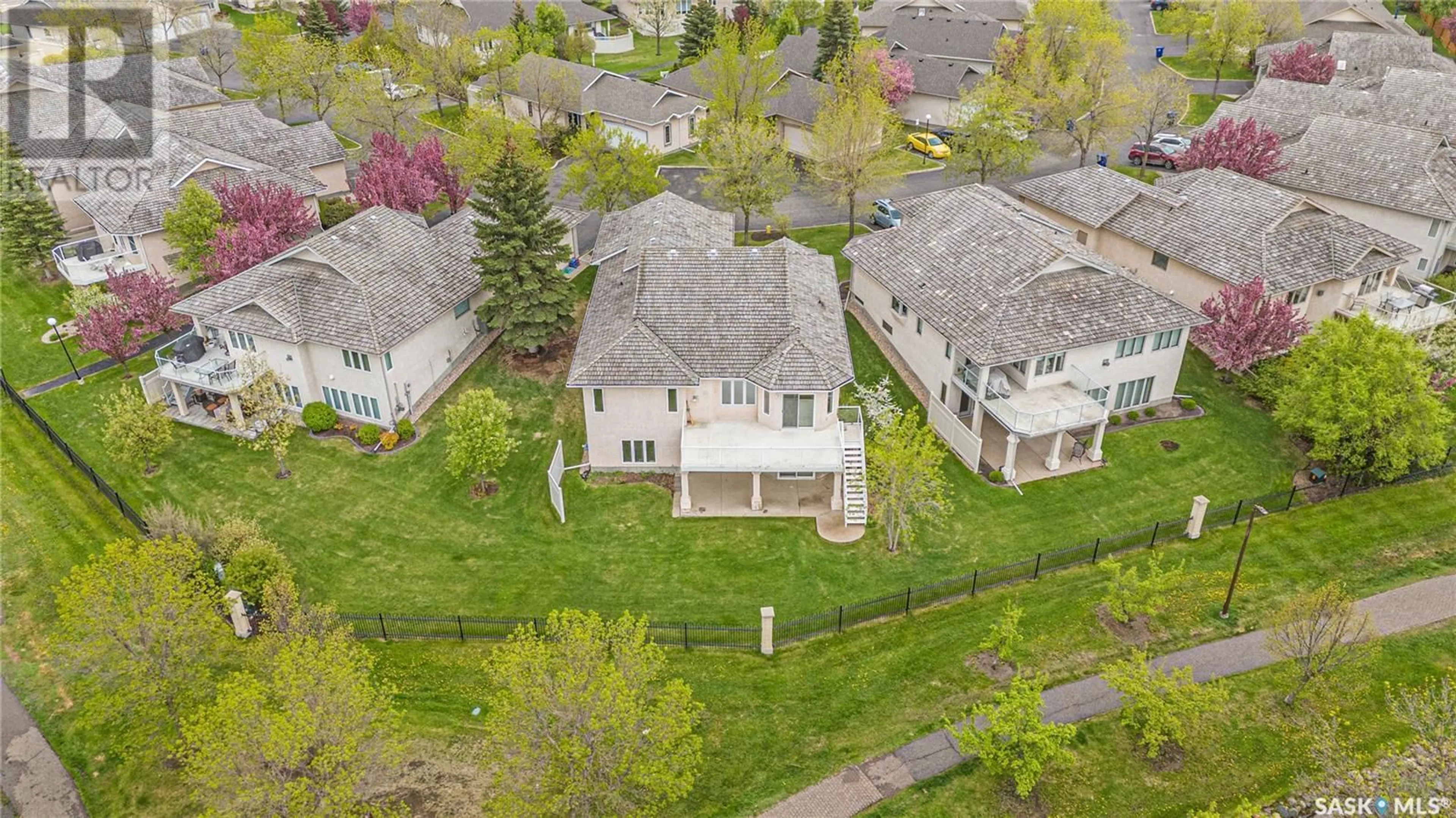 A pic from outside/outdoor area/front of a property/back of a property/a pic from drone, street for 6 330 STODOLA COURT, Saskatoon Saskatchewan S7N4N9