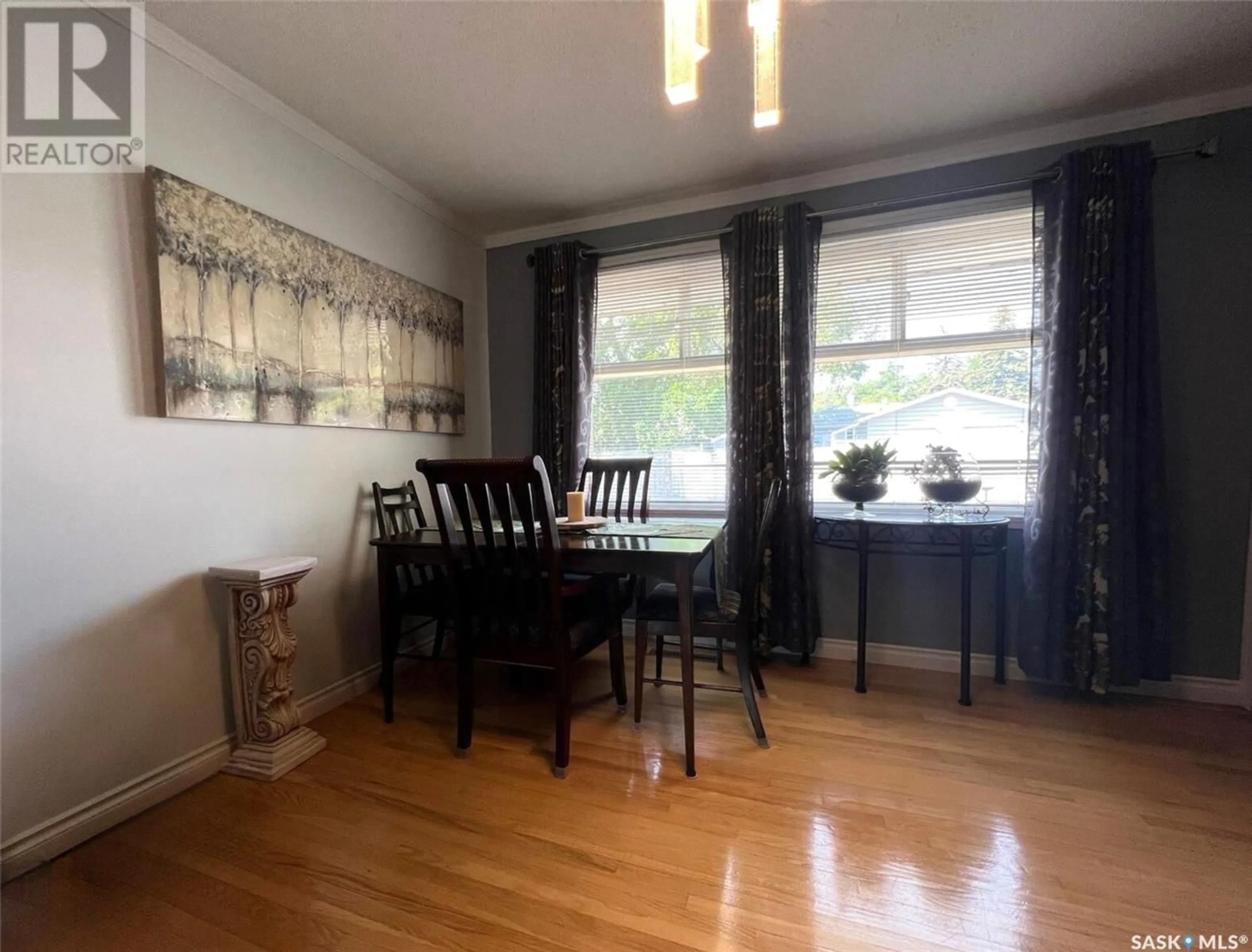 Dining room, wood/laminate floor for 830 4TH AVENUE, Swift Current Saskatchewan S9H2K6