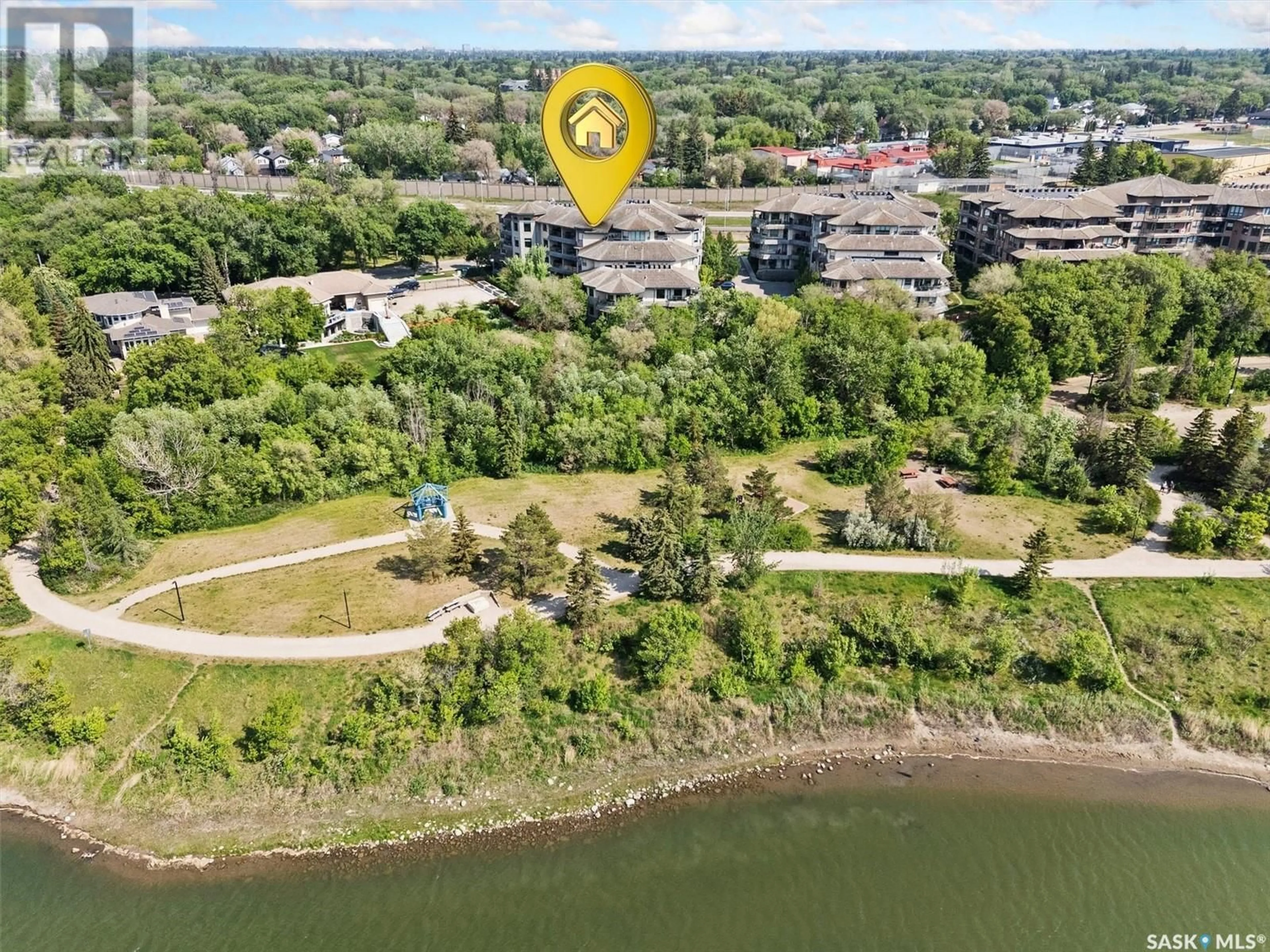 A pic from outside/outdoor area/front of a property/back of a property/a pic from drone, water/lake/river/ocean view for 201 615 SASKATCHEWAN CRESCENT, Saskatoon Saskatchewan S7M0A5