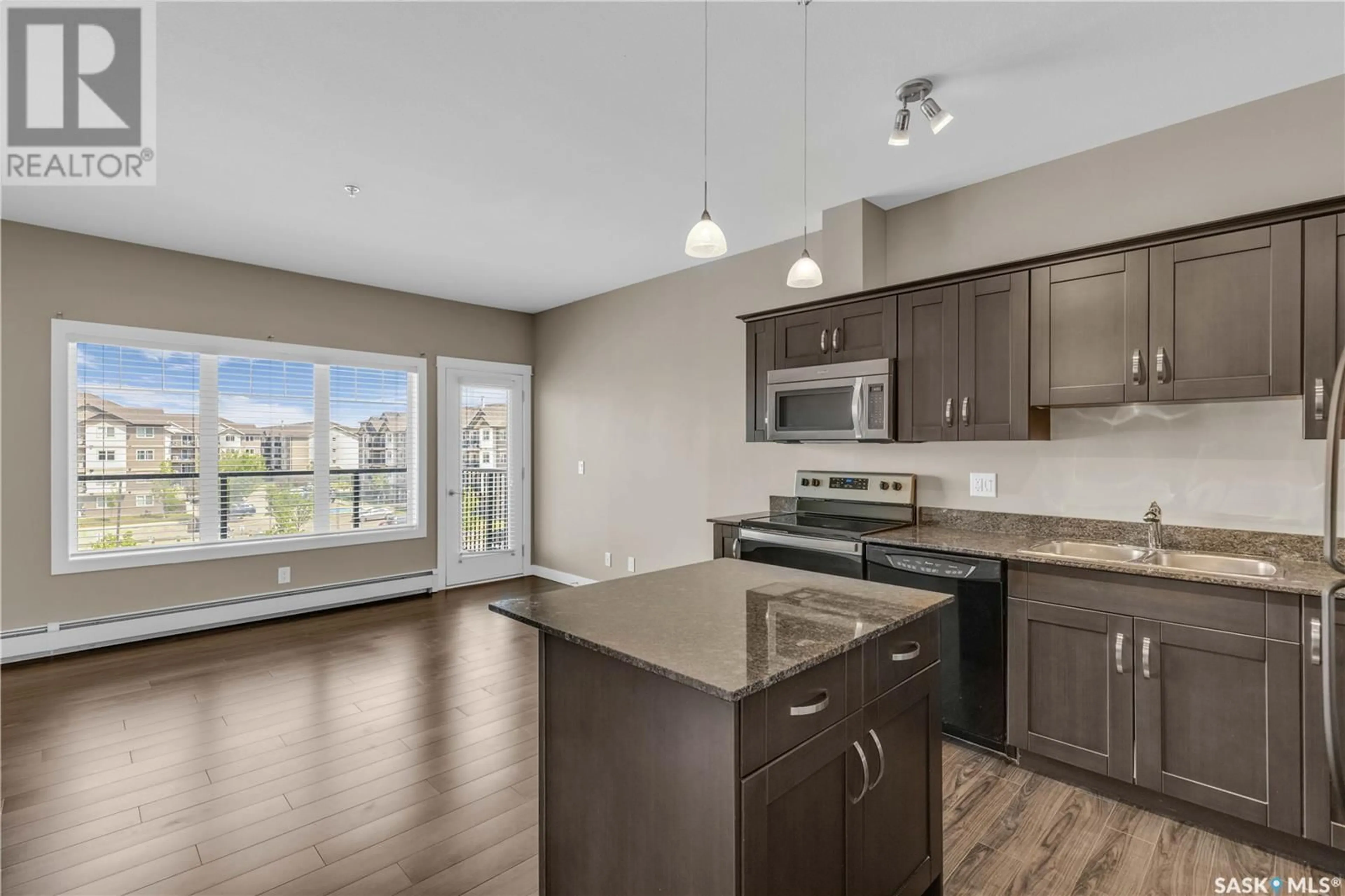 Open concept kitchen, wood/laminate floor for 706 - 303 HART ROAD, Saskatoon Saskatchewan S0K1A0