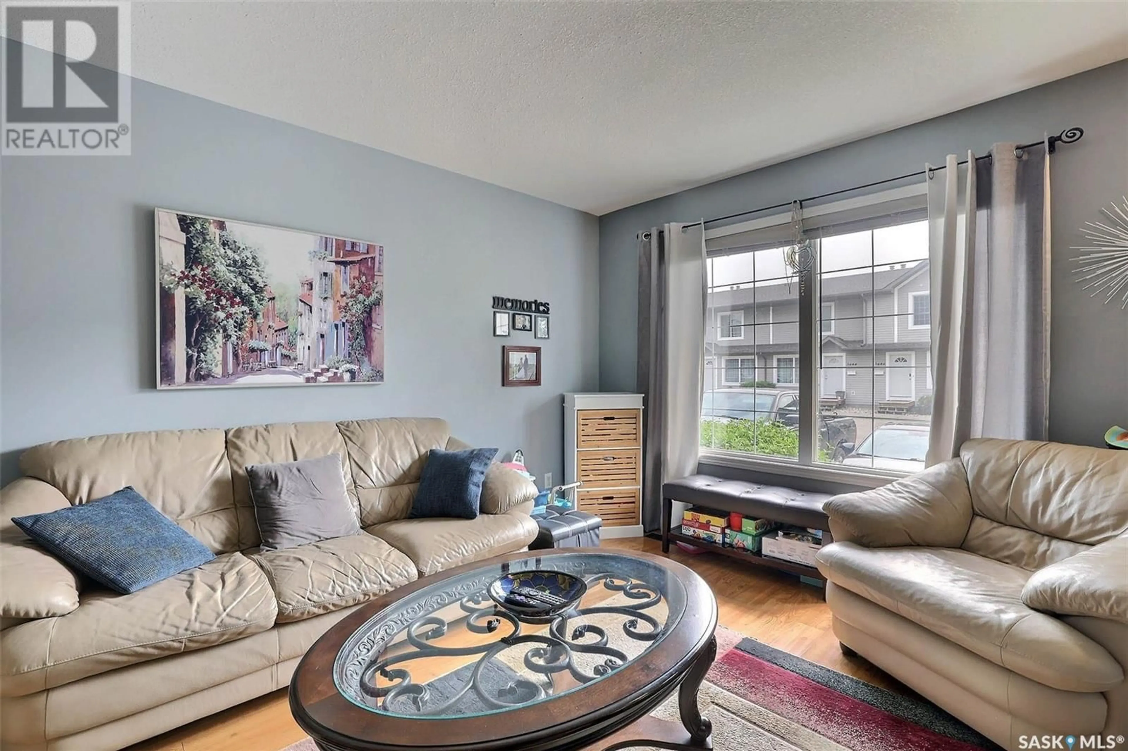 Living room with furniture, wood/laminate floor for 3614 7TH AVENUE, Regina Saskatchewan S4N7R4
