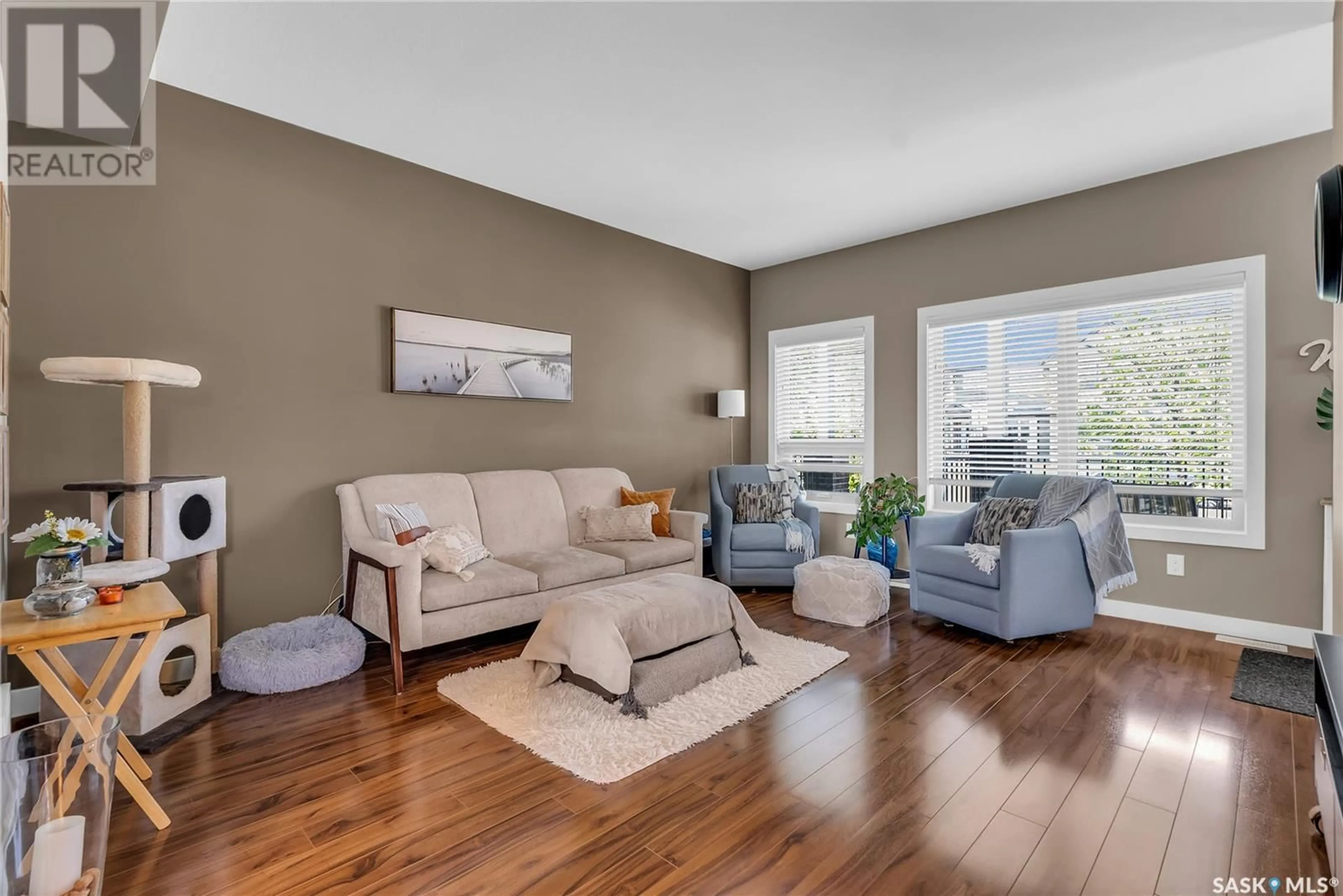 Living room with furniture, wood/laminate floor for N - 176 ROSEWOOD GATE, Saskatoon Saskatchewan S7V0J1