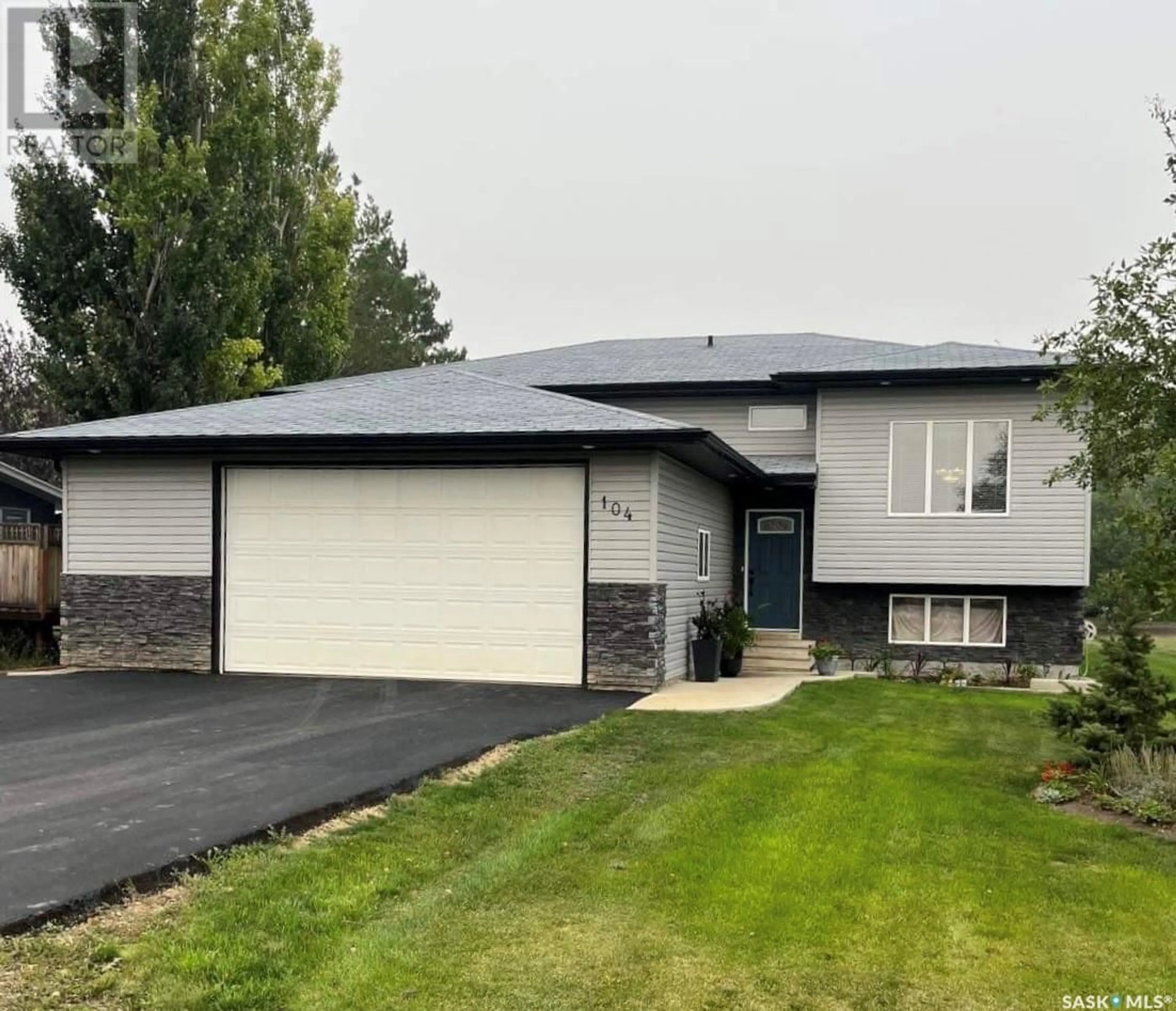 Home with vinyl exterior material, street for 104 4TH STREET, Milden Saskatchewan S0L2L0