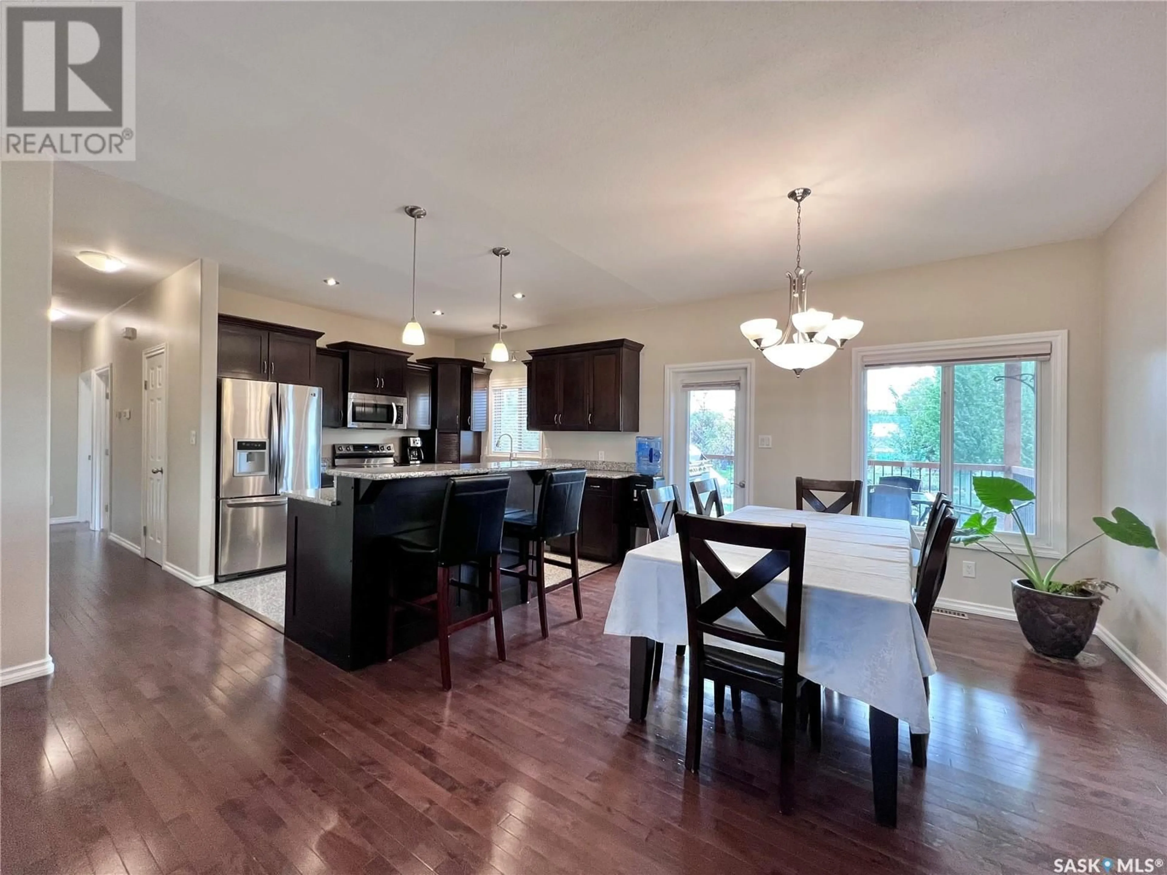 Open concept kitchen, wood/laminate floor for 104 4TH STREET, Milden Saskatchewan S0L2L0