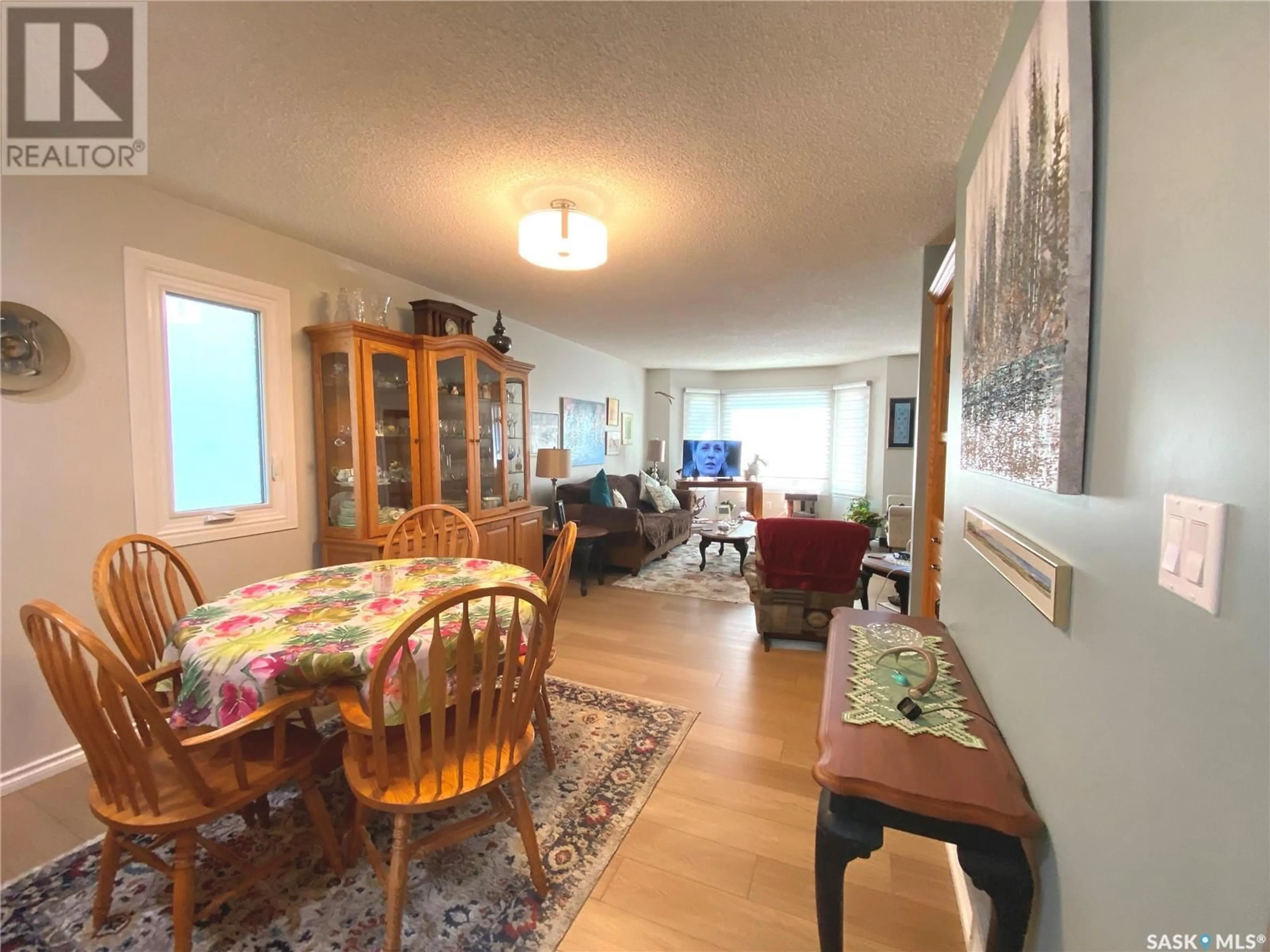 Living room with furniture, wood/laminate floor for 315 HUDSON AVENUE, Fort Qu'Appelle Saskatchewan S0G1S0