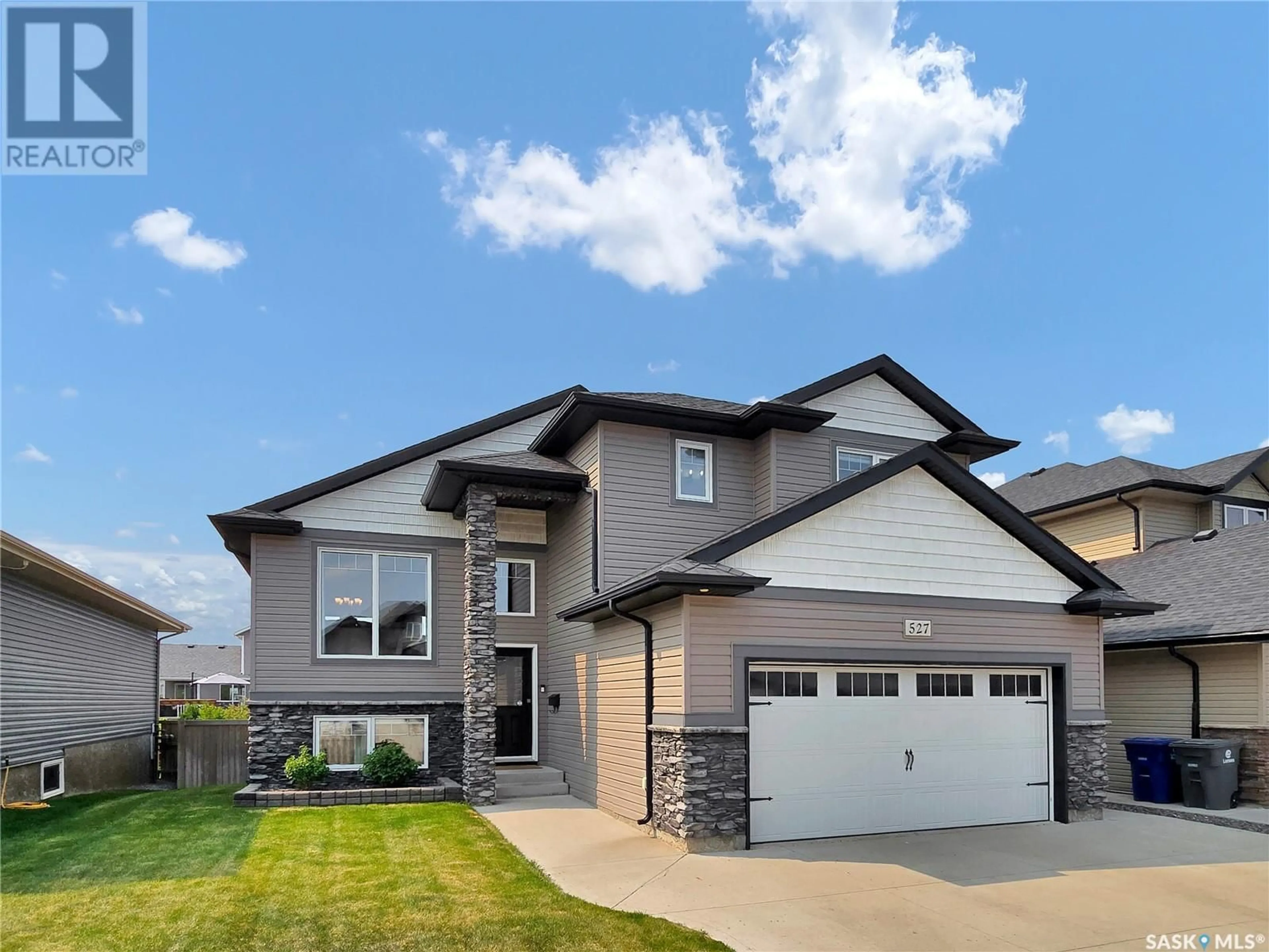 Home with brick exterior material, street for 527 REDWOOD CRESCENT, Warman Saskatchewan S0K4S2