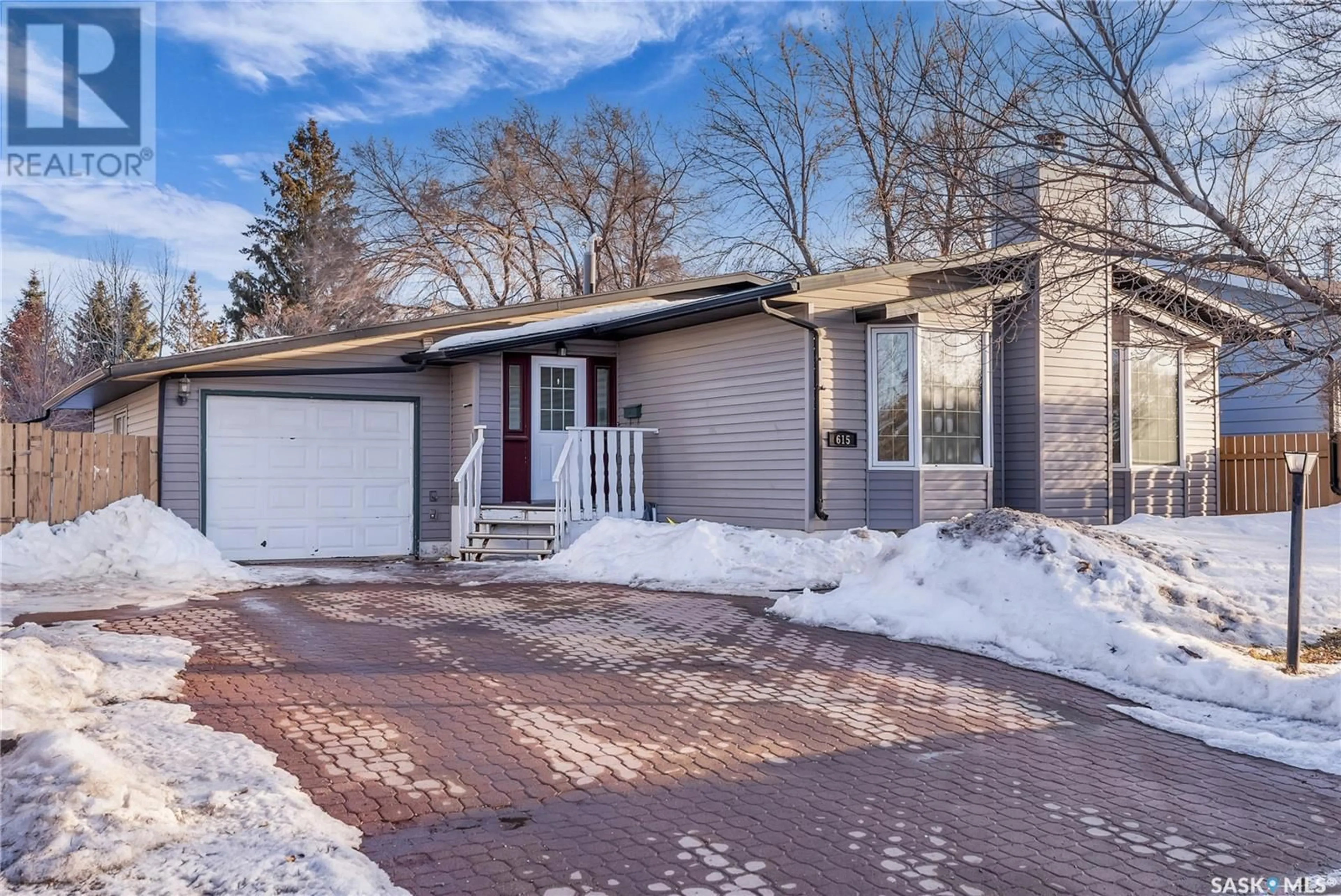 Home with brick exterior material, street for 615 LENORE DRIVE, Saskatoon Saskatchewan S7K5G7