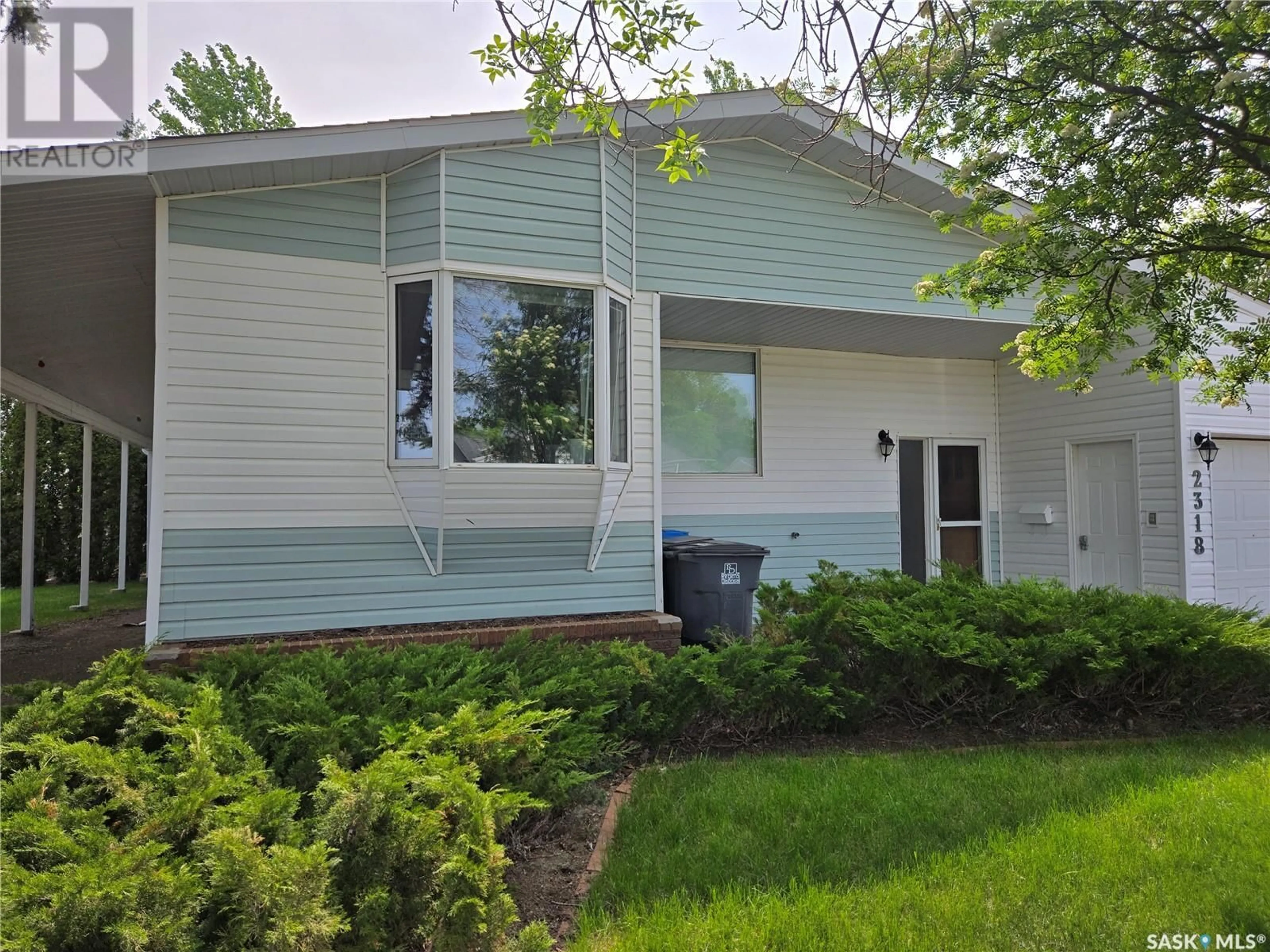 Home with vinyl exterior material, street for 2318 VICTORY ROAD, Estevan Saskatchewan S4A1Y4